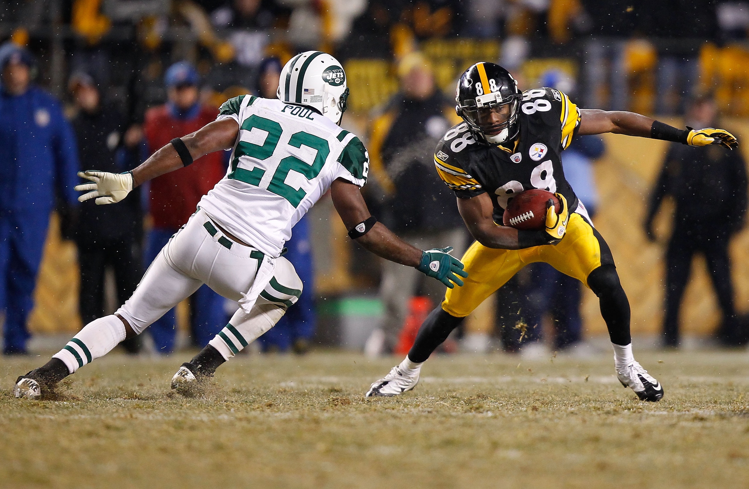 PITTSBURGH - DECEMBER 19:  Emmanuel Sanders #88 of the Pittsburgh Steelers evades a tackle by Brodney Pool #22 of the New York Jets during the game on December 19, 2010 at Heinz Field in Pittsburgh, Pennsylvania.  (Photo by Jared Wickerham/Getty Images)
