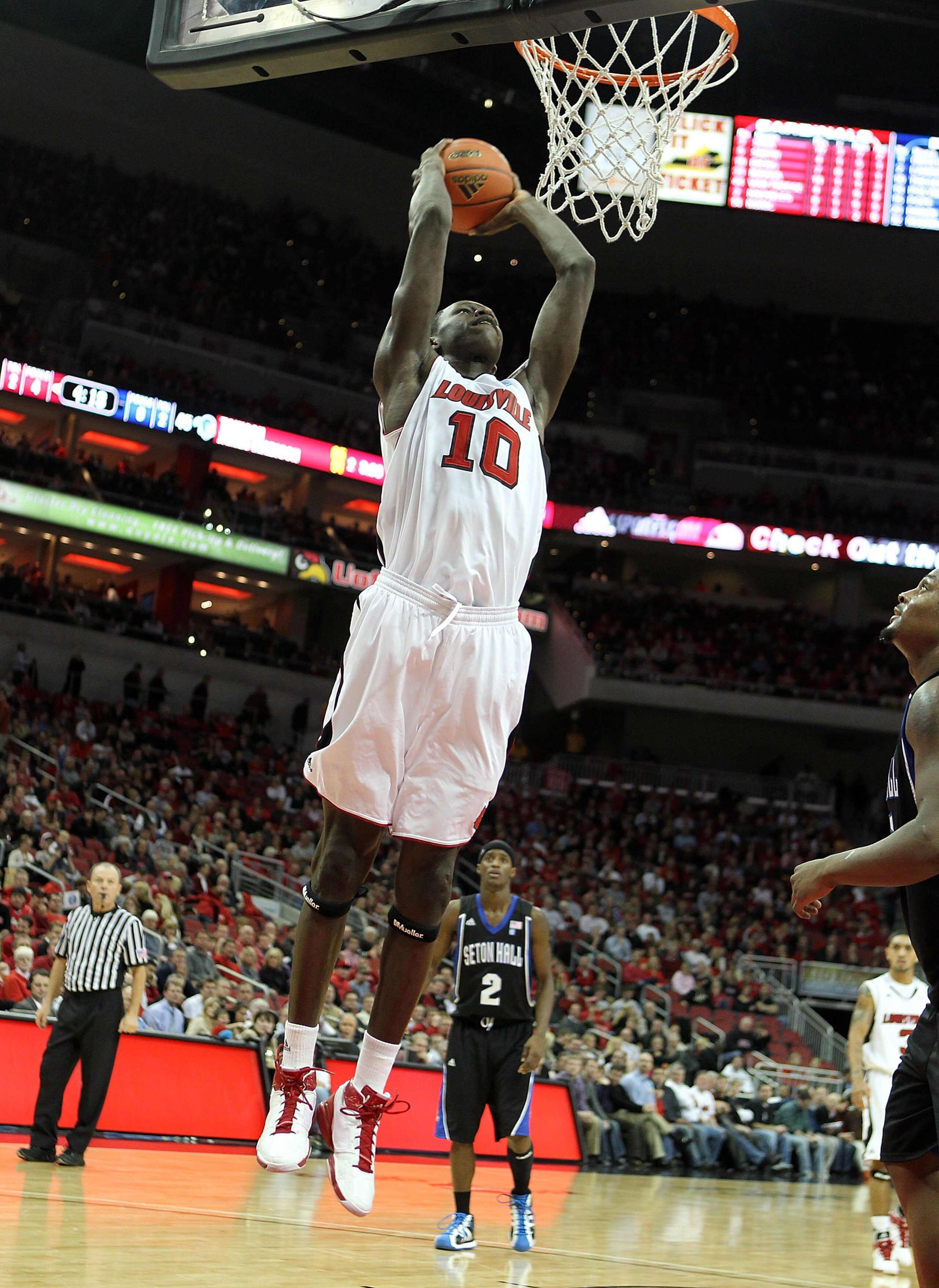 LOUISVILLE, KY - JANUARY 05:  Gorgui Dieng #10 of the Louisville Cardinals shoots the ball during the Big East Conference game against the Seton Hall Pirates at the KFC Yum! Center on January 5, 2011 in Louisville, Kentucky. Louisville won 73-54.  (Photo