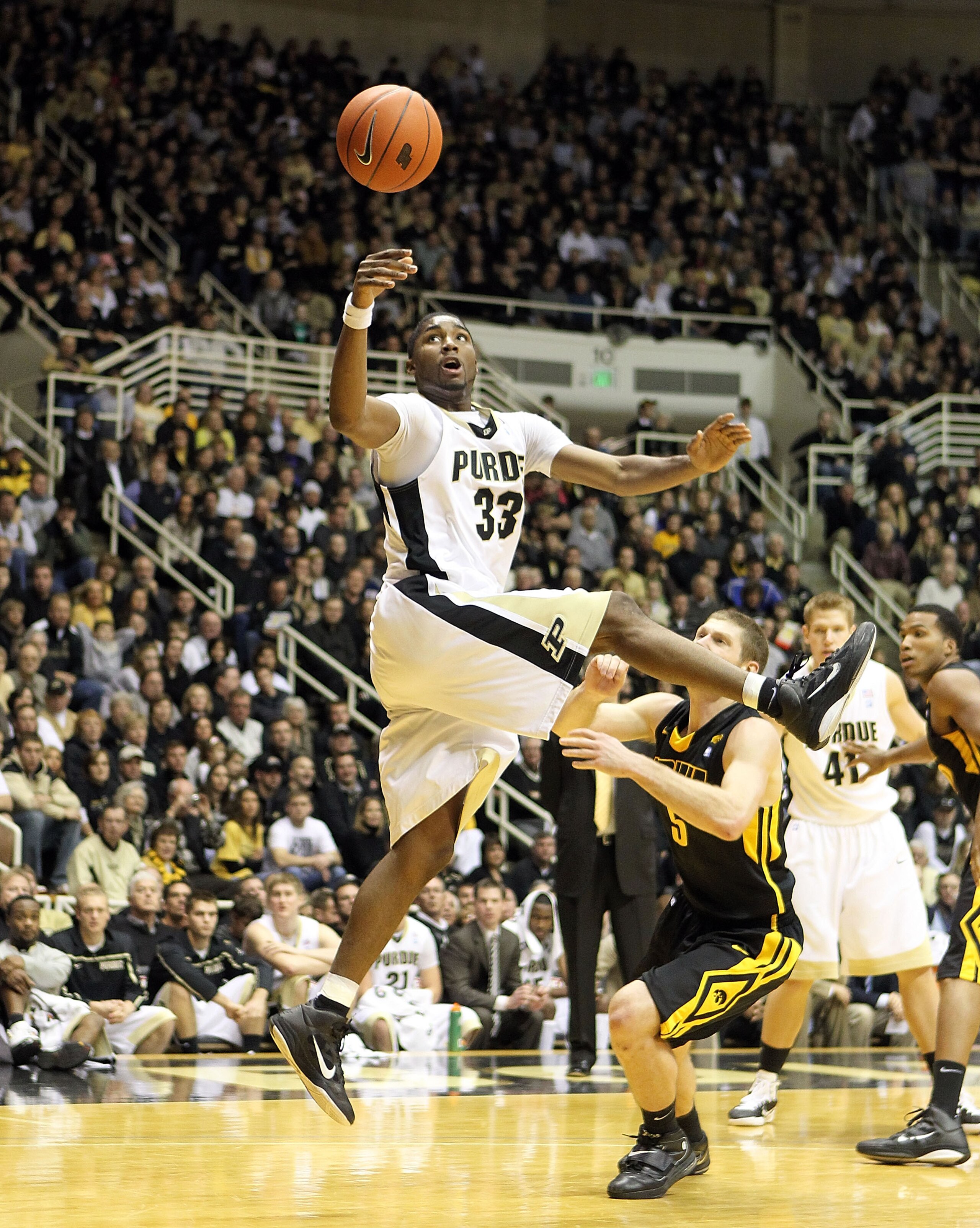 WEST LAFAYETTE, IN - JANUARY 09:  E'Twaun Moore #33 of the Purdue Boilermakers reaches for the ball against the Iowa Hawkeyes during the Big Ten Conference game at Mackey Arena on January 9, 2011 in West Lafayette, Indiana. Purdue won 75-52. (Photo by And