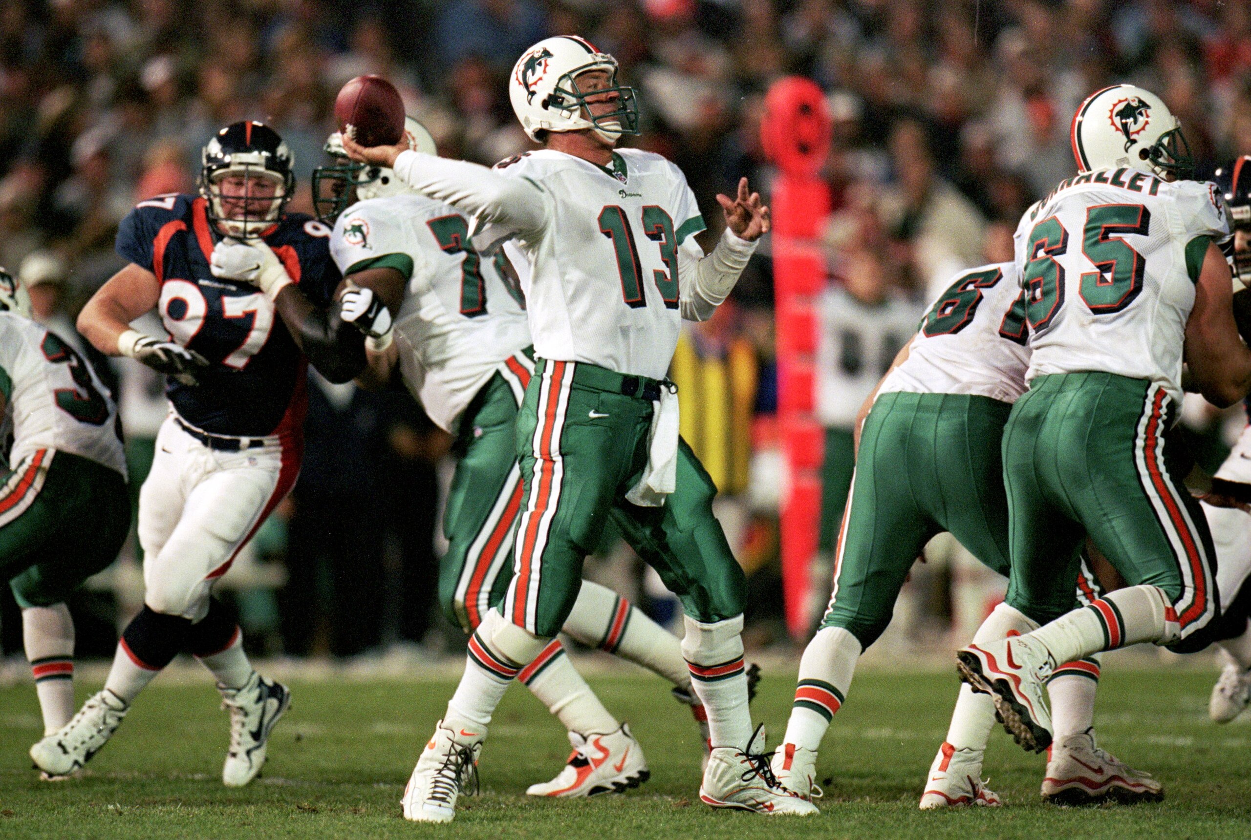 13 Sep 1999: Quarterback Dan Marino #13 of the Miami Dolphins passes the ball during the game against the Denver Broncos at the Mile High Stadium in Denver, Colorado. The Dolphins defeated the Broncos 38-21. Mandatory Credit: Brian Bahr  /Allsport