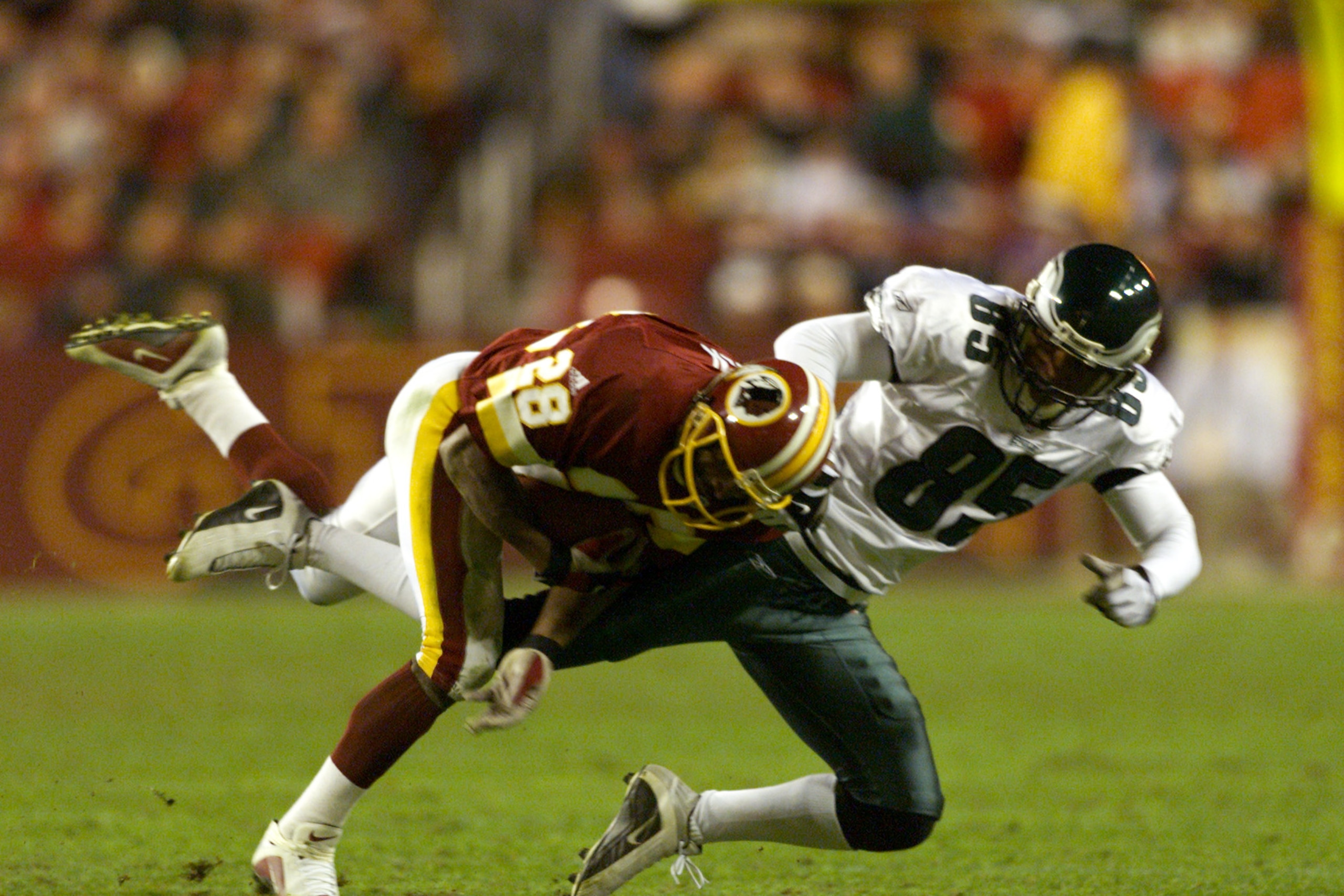 16 Dec 2001 : Darrell Green #28 of the Washington Redskins  races Na Brown #85 of the Philadelphia Eagles during the game at Fed Ex Field in Landover, Michigan. The Eagles defeated the Redskins 20-6. DIGITAL IMAGE. Mandatory Credit : Jamie Squire/Getty Im