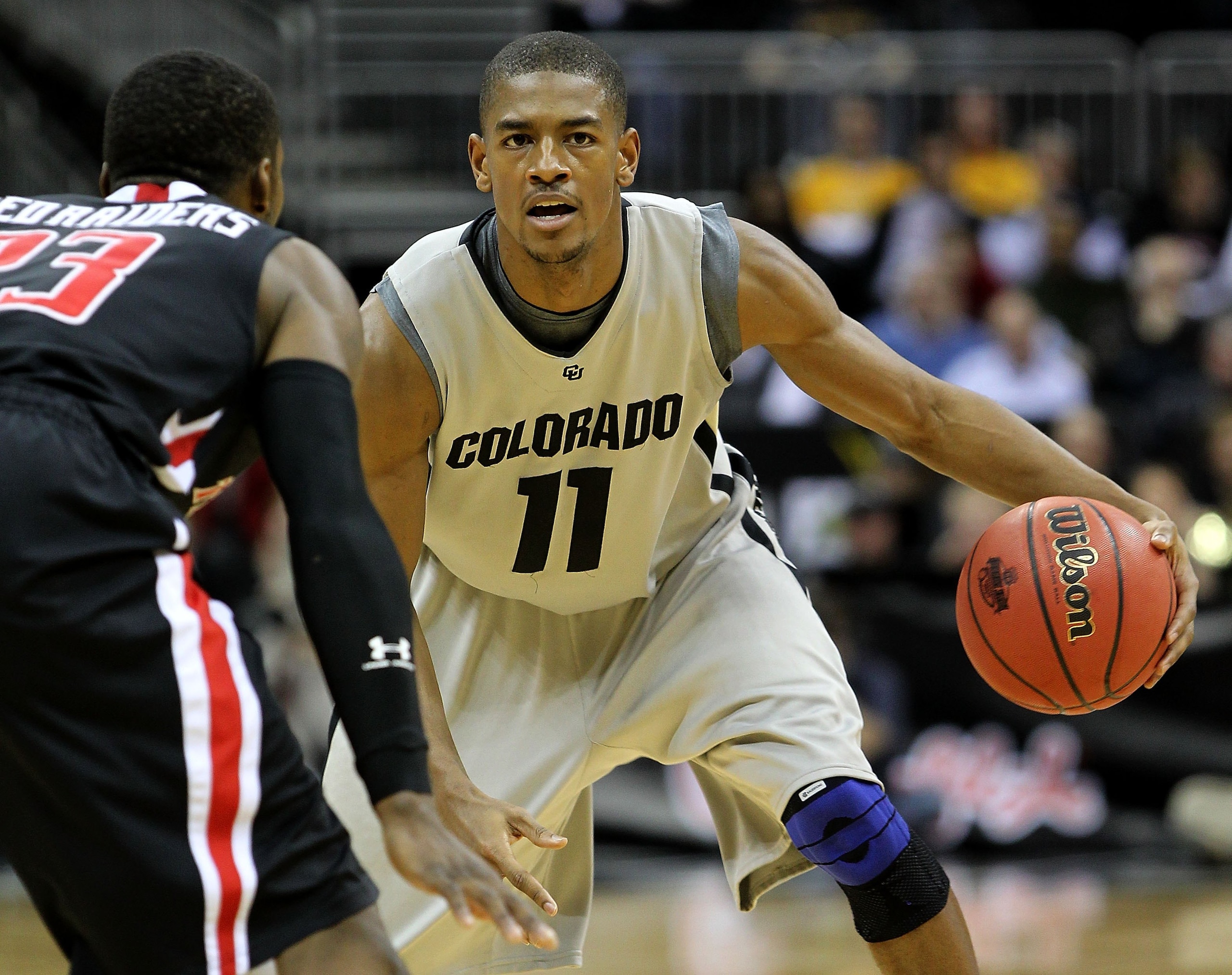 KANSAS CITY, MO - MARCH 10:  Cory Higgins #11 of the Colorado Buffaloes moves the ball against the Texas Tech Red Raiders in the first half during the first round game of the 2010 Phillips 66 Big 12 Men's Basketball Tournament at the Sprint Center on Marc