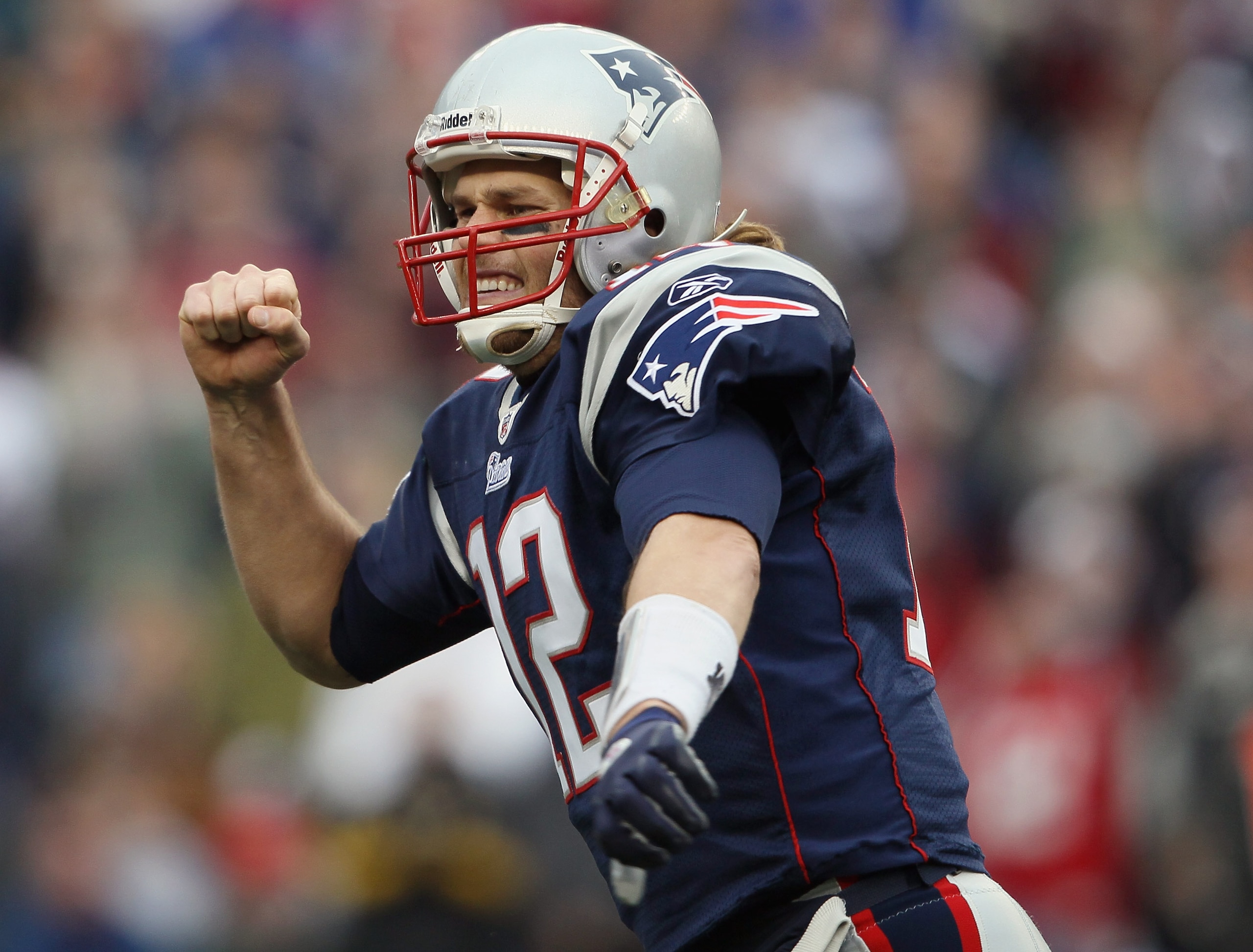 FOXBORO, MA - JANUARY 02:  Tom Brady #12 of the New England Patriots celebrates a touchdown by teammate BenJarvis Green-Ellis in the first quarter against the Miami Dolphins on January 2, 2011 at Gillette Stadium in Foxboro, Massachusetts.  (Photo by Elsa
