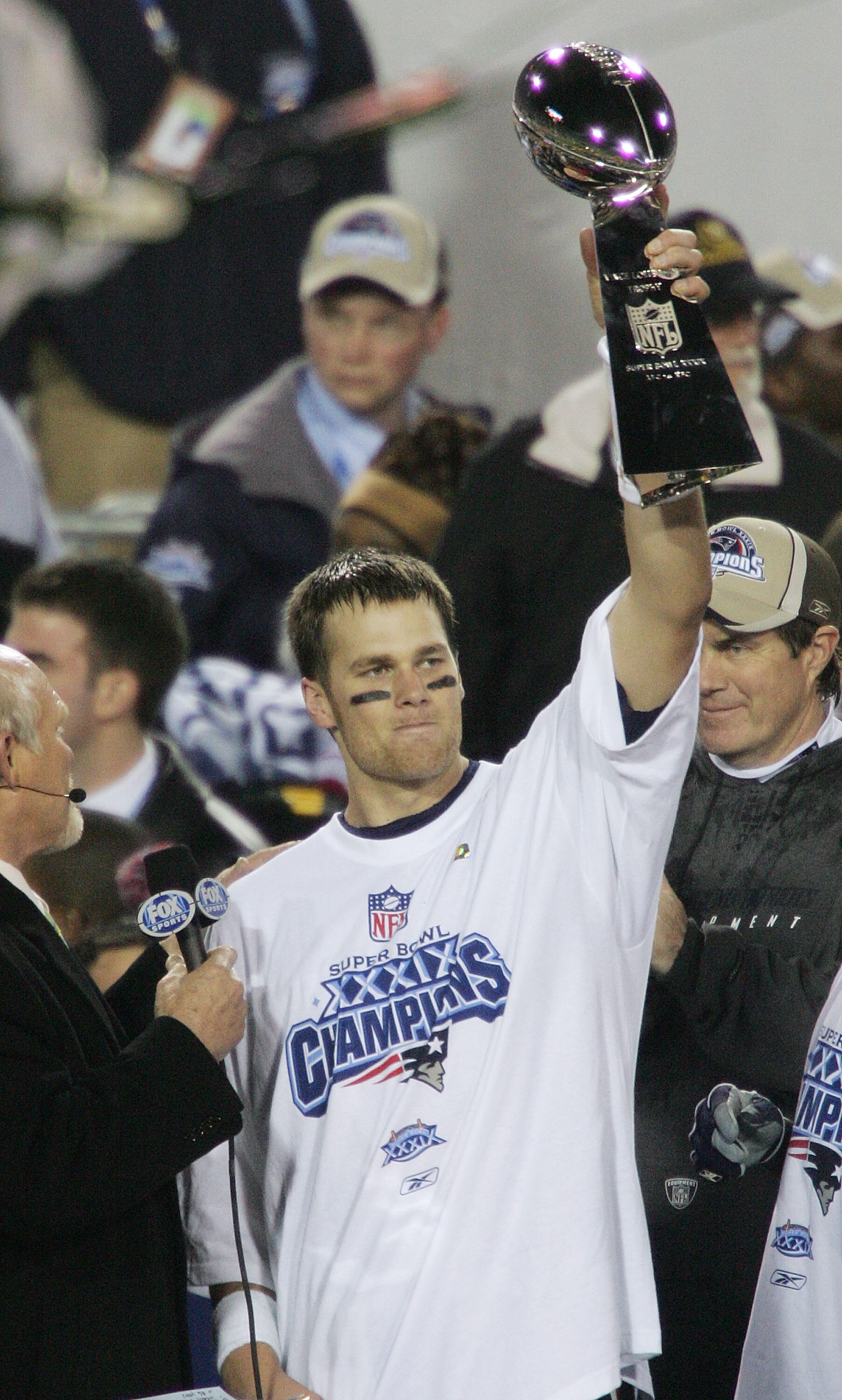 JACKSONVILLE, FLORIDA - FEBRUARY 06:  Quarterback Tom Brady #12 of the New England Patriots celebrates with the Lombardi trophy after defeating the Philadelphia Eagles in Super Bowl XXXIX at Alltel Stadium on February 6, 2005 in Jacksonville, Florida.  Th
