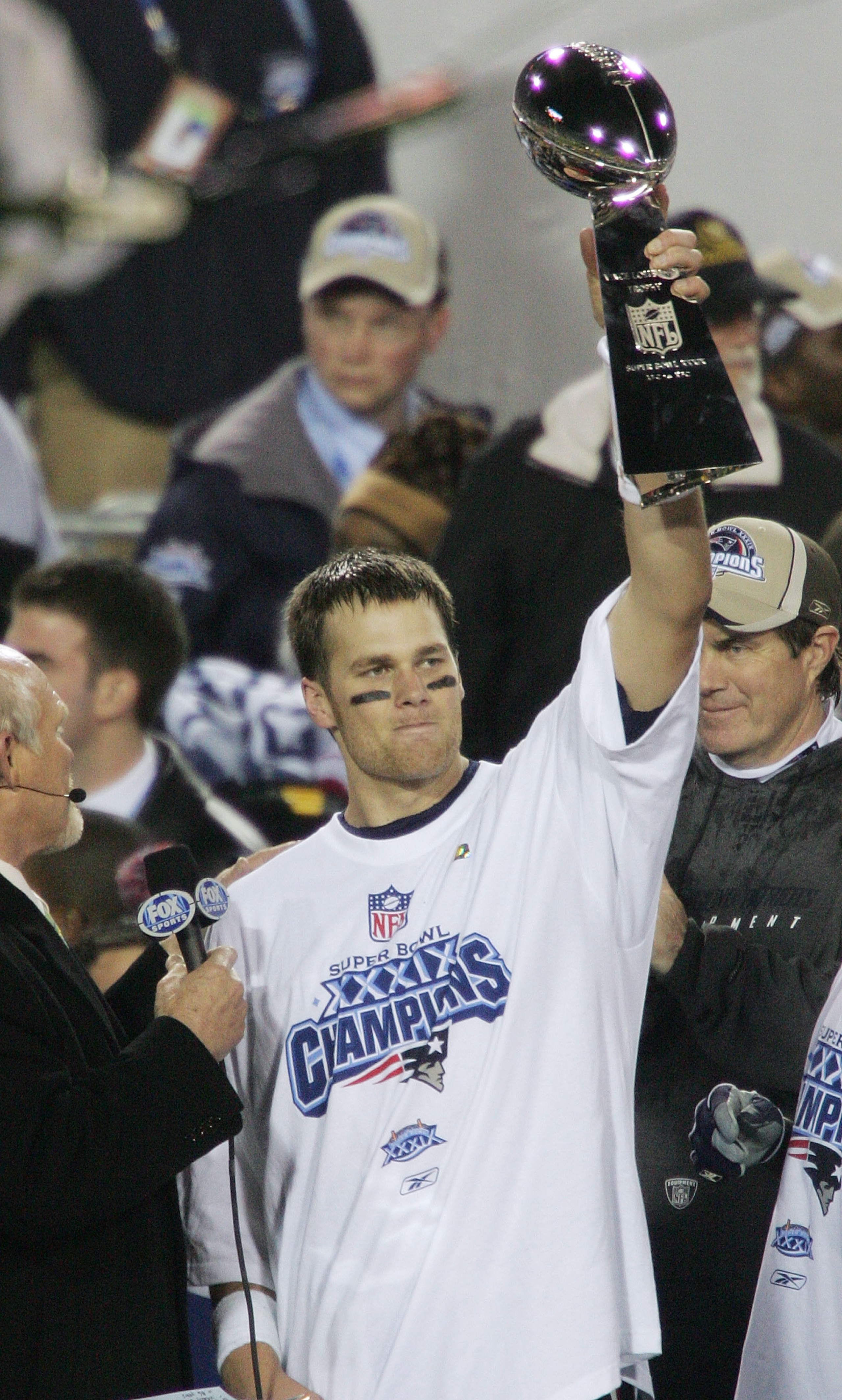 JACKSONVILLE, FLORIDA - FEBRUARY 06:  Quarterback Tom Brady #12 of the New England Patriots celebrates with the Lombardi trophy after defeating the Philadelphia Eagles in Super Bowl XXXIX at Alltel Stadium on February 6, 2005 in Jacksonville, Florida.  Th