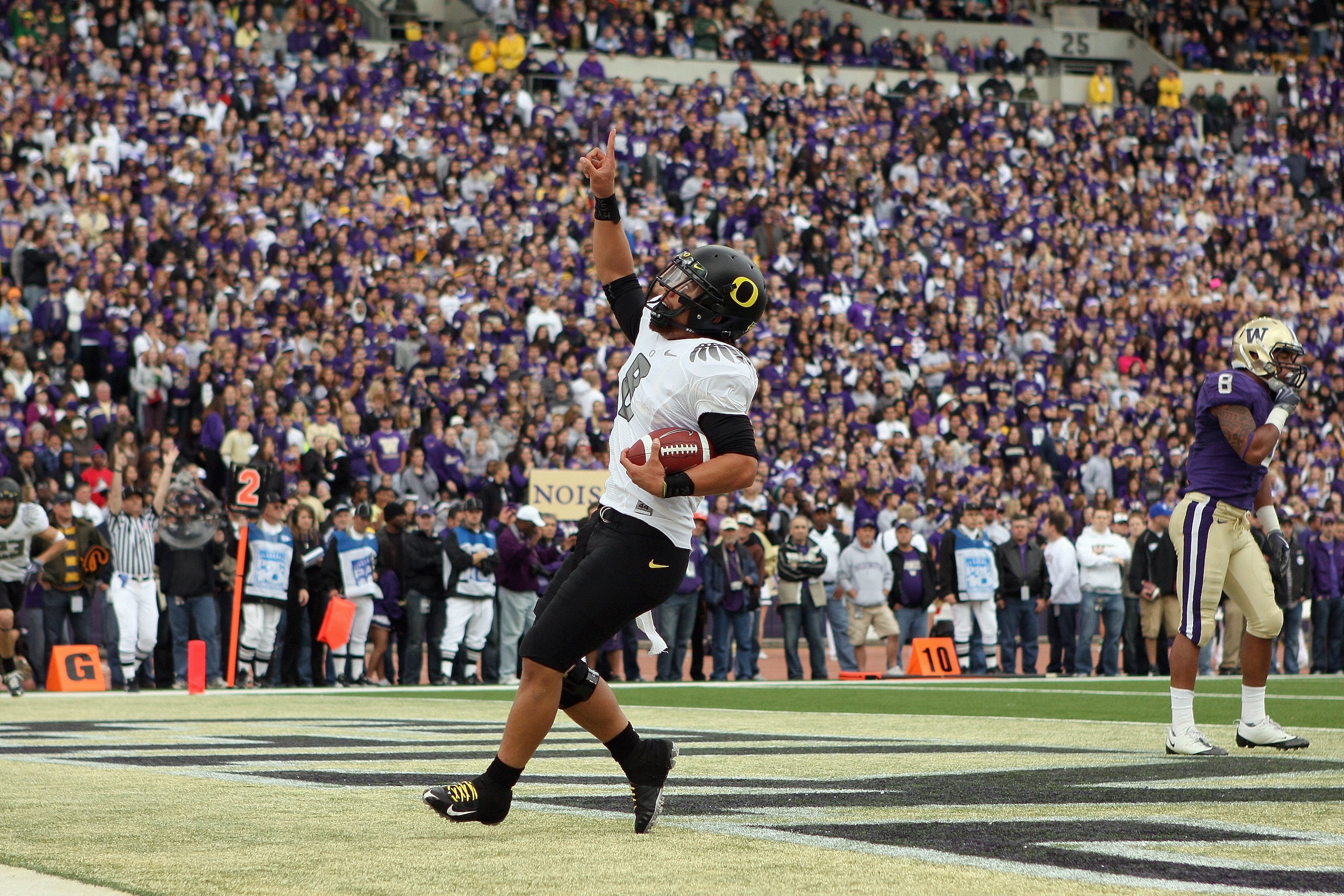 SEATTLE - OCTOBER 24: Quarterback Jeremiah Masoli #8 of the Oregon Ducks celebrates his touchdwon against the Washington Huskies on October 24, 2009 at Husky Stadium in Seattle, Washington. The Ducks defeated the Huskies 43-19. (Photo by Otto Greule Jr/G SEATTLE - OCTOBER 24: Quarterback Jeremiah Masoli #8 of the Oregon Ducks celebrates his touchdwon against the Washington Huskies on October 24, 2009 at Husky Stadium in Seattle, Washington. The Ducks defeated the Huskies 43-19. (Photo by Otto Greule Jr/G