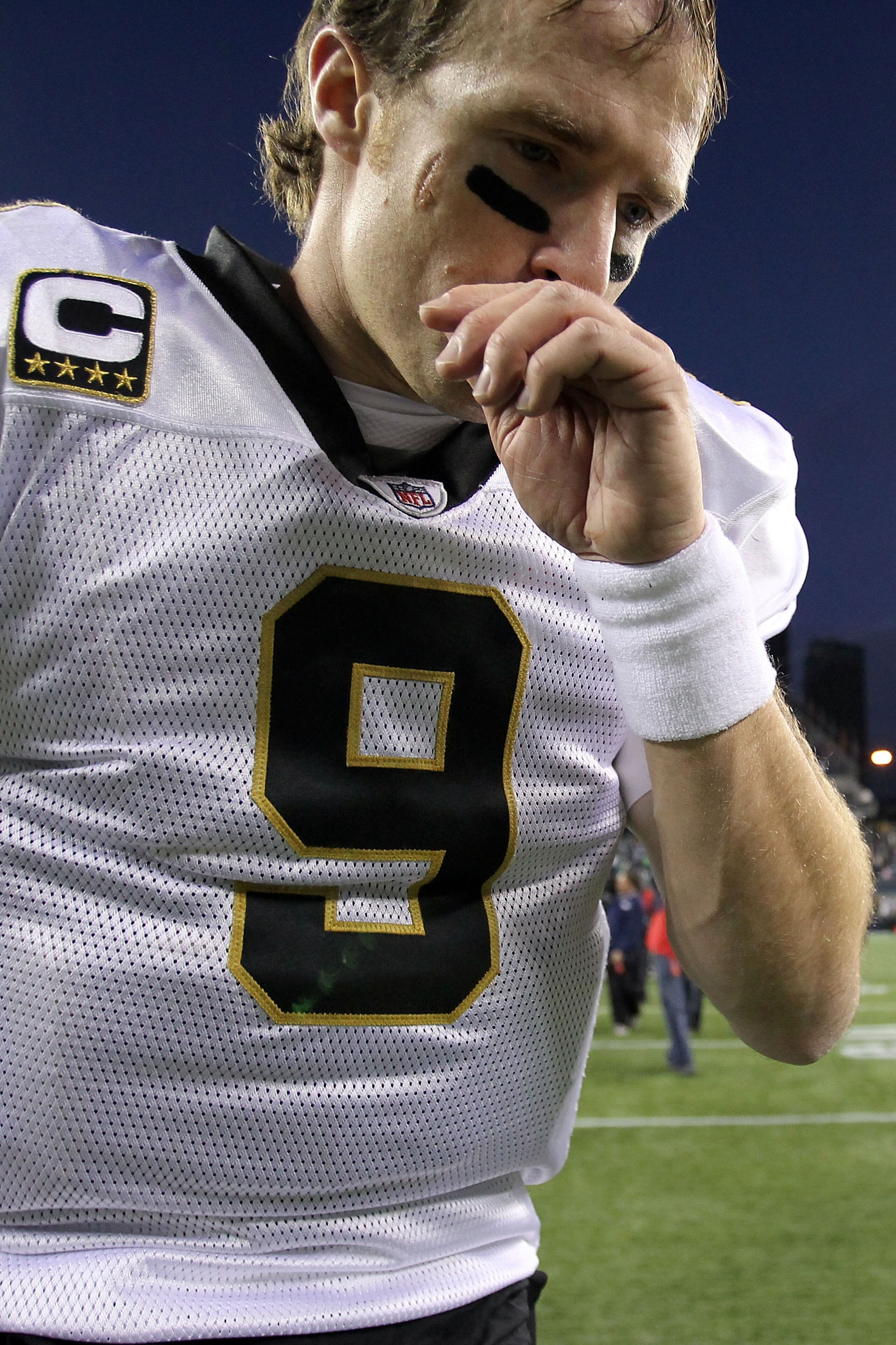 SEATTLE, WA - JANUARY 08:  Quarterback Drew Brees #9 of the New Orleans Saints walks off the field after the Saints were defeated 41-36 by the Seattle Seahawks during the 2011 NFC wild-card playoff game at Qwest Field on January 8, 2011 in Seattle, Washin