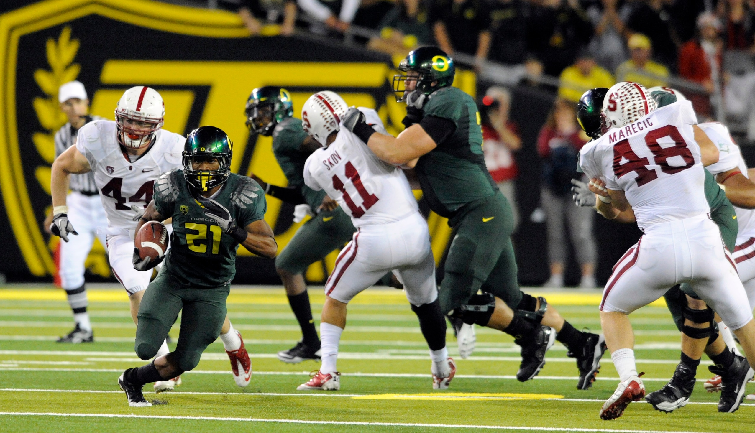 EUGENE, OR - OCTOBER 2: Running back LaMichael James #21 of the Oregon Ducks breaks into the open as linebacker Chase Thomas #44, linebacker Shane Skov #11 and linebacker Owen Merecic #48 of the Stanford Cardinal try to catch him during the third quarter EUGENE, OR - OCTOBER 2: Running back LaMichael James #21 of the Oregon Ducks breaks into the open as linebacker Chase Thomas #44, linebacker Shane Skov #11 and linebacker Owen Merecic #48 of the Stanford Cardinal try to catch him during the third quarter