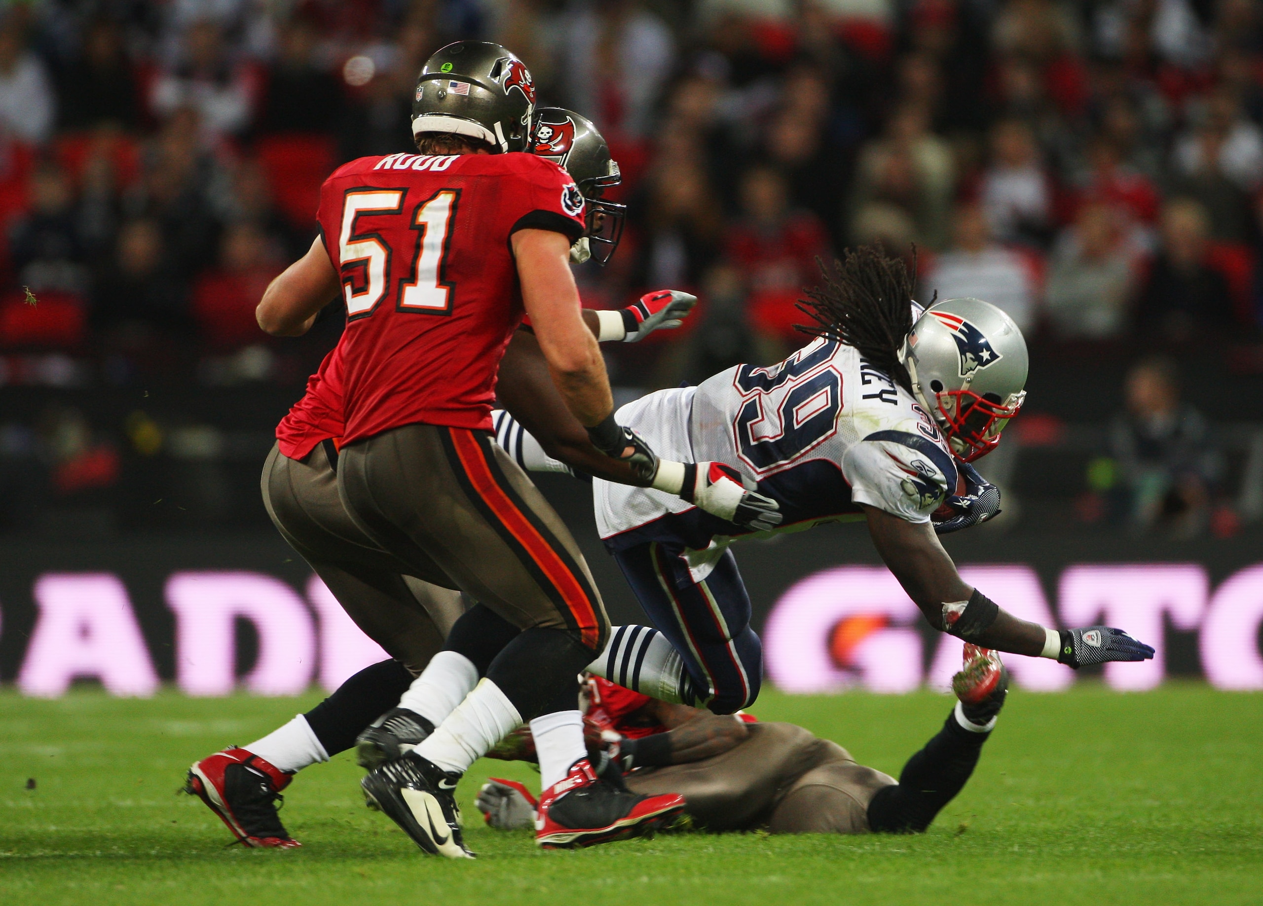 LONDON, ENGLAND - OCTOBER 25:  Laurence Maroney (#39) of the New England Patriots  is tackled by Barrett Ruud (#51) of Tampa Bay Buccaneers during the NFL International Series match between New England Patriots and Tampa Bay Buccaneers at Wembley Stadium