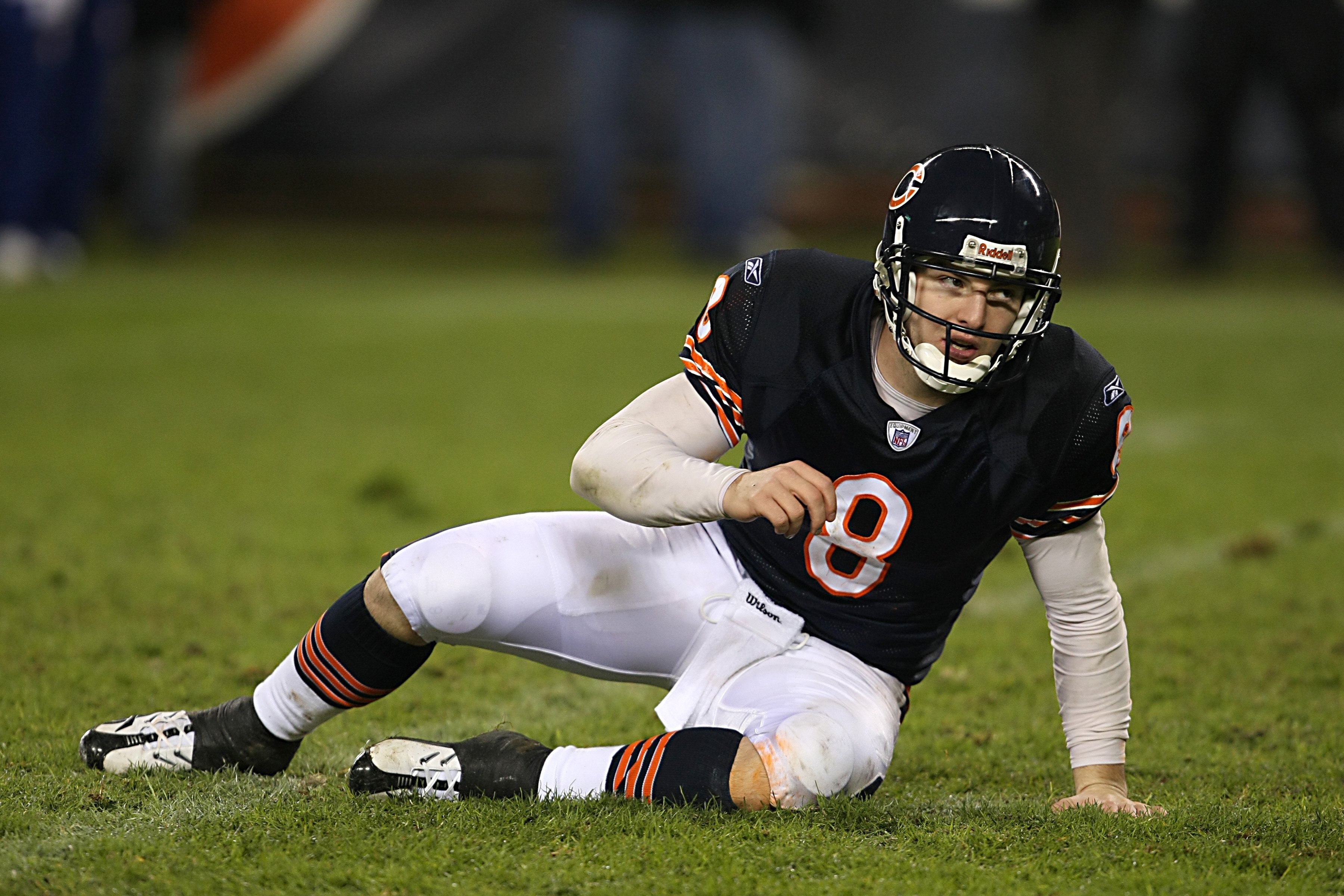 CHICAGO - DECEMBER 2:  Rex Grossman #8 of the Chicago Bears stretches on the field during the NFL game against the New York Giants at Soldier Field on December 2, 2007 in Chicago, Illinois. (Photo by Jonathan Daniel/Getty Images)
