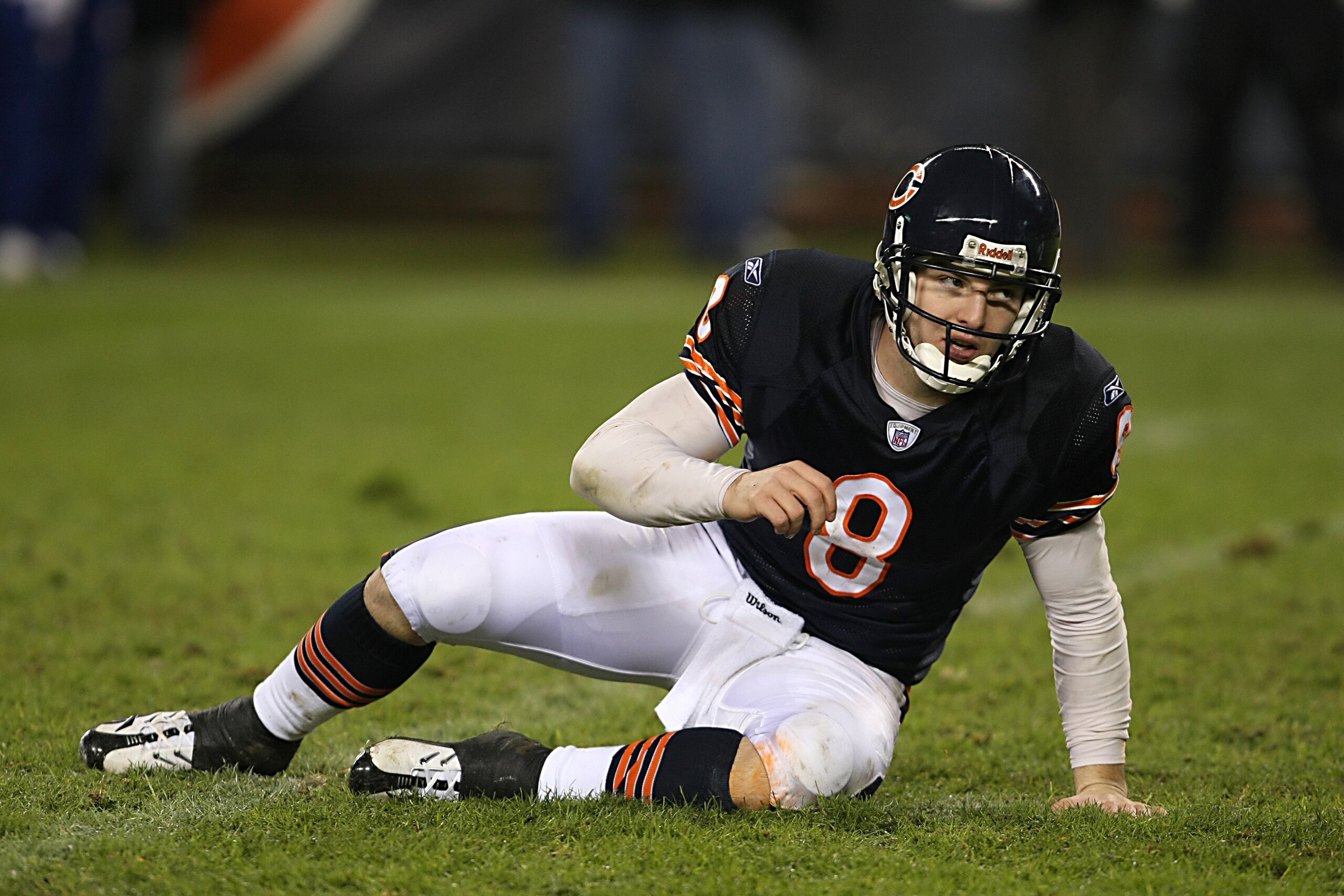 CHICAGO - DECEMBER 2:  Rex Grossman #8 of the Chicago Bears stretches on the field during the NFL game against the New York Giants at Soldier Field on December 2, 2007 in Chicago, Illinois. (Photo by Jonathan Daniel/Getty Images)