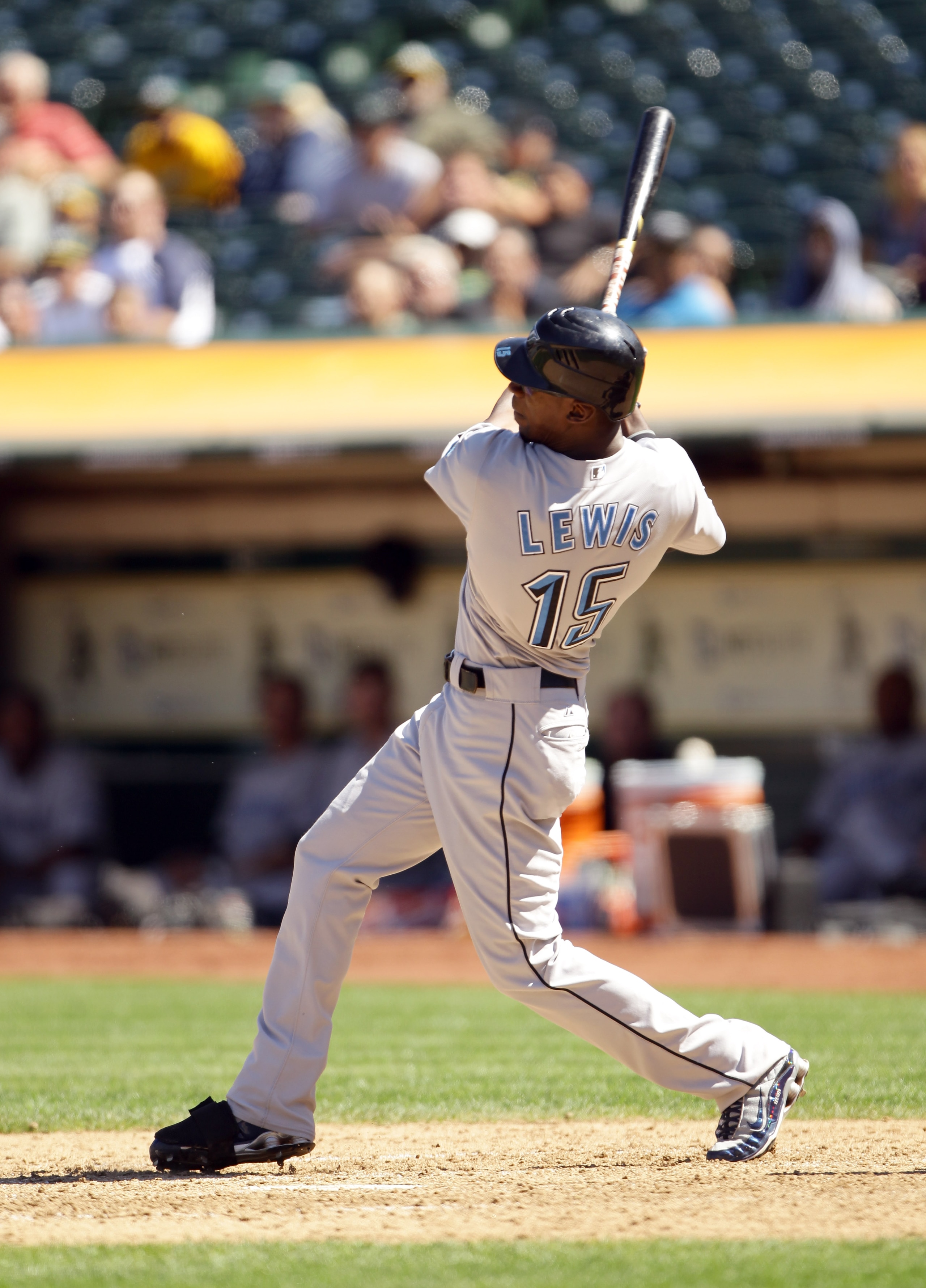 OAKLAND, CA - AUGUST 18:   Fred Lewis #15 of the Toronto Blue Jays hits a single to score  Lyle Overbay #35 and Dewayne Wise #1 to tie the game 4-4 against the Oakland Athletics in the ninth inning at the Oakland-Alameda County Coliseum on August 18, 2010