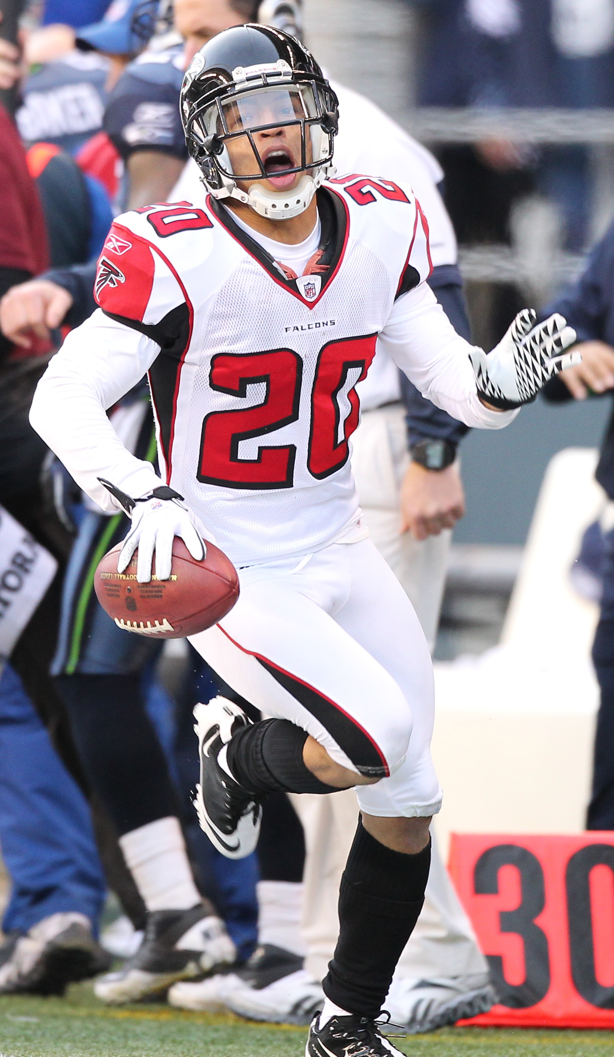 SEATTLE, WA - DECEMBER 19:  Brent Grimes #20 of the Atlanta Falcons celebrates after making an interception against the Seattle Seahawks at Qwest Field on December 19, 2010 in Seattle, Washington. The Falcons defeated the Seahawks 34-18. (Photo by Otto Gr