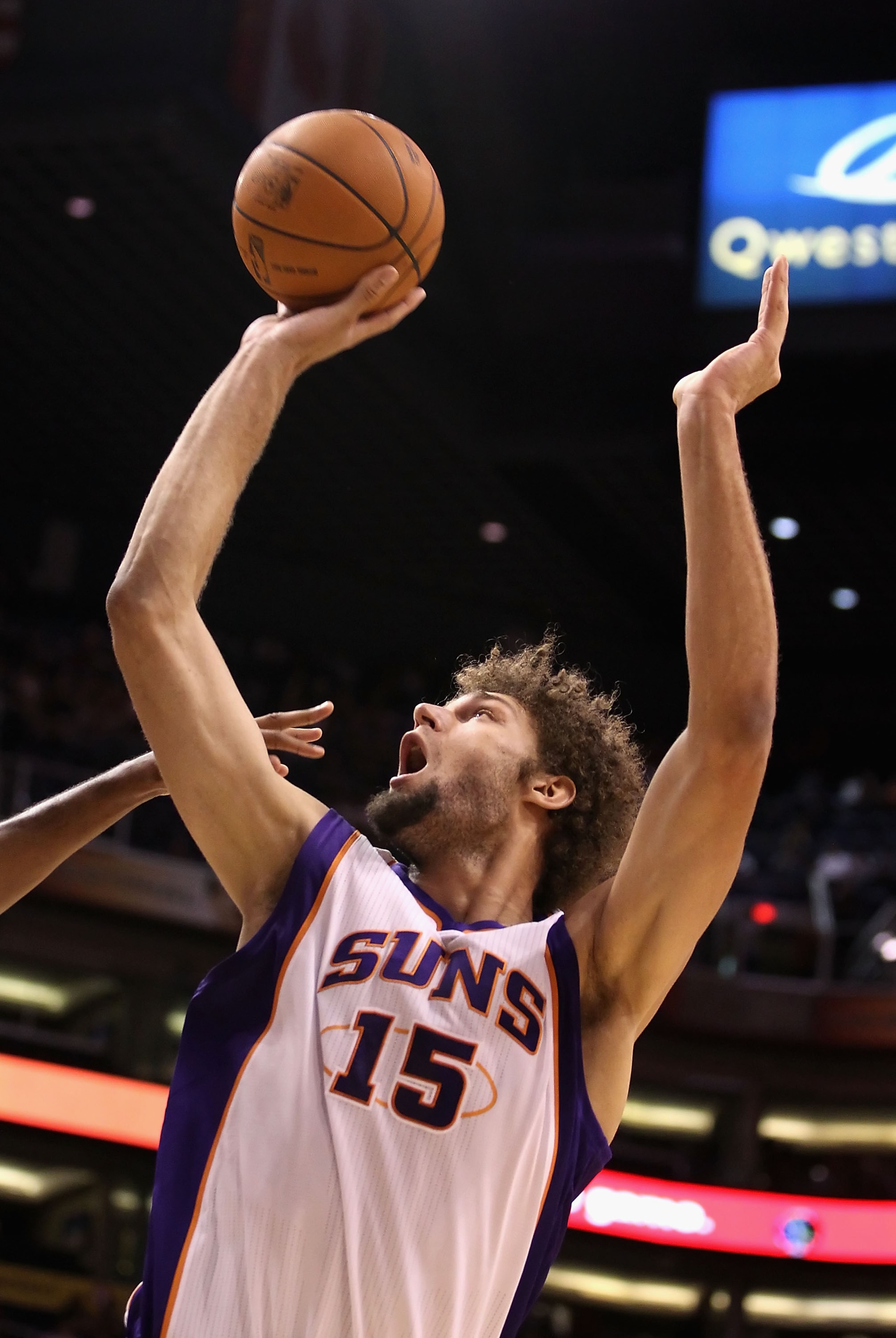 PHOENIX - OCTOBER 19:  Robin Lopez #15 of the Phoenix Suns puts up a shot against the Golden State Warriors during the preseason NBA game at US Airways Center on October 19, 2010 in Phoenix, Arizona. NOTE TO USER: User expressly acknowledges and agrees th