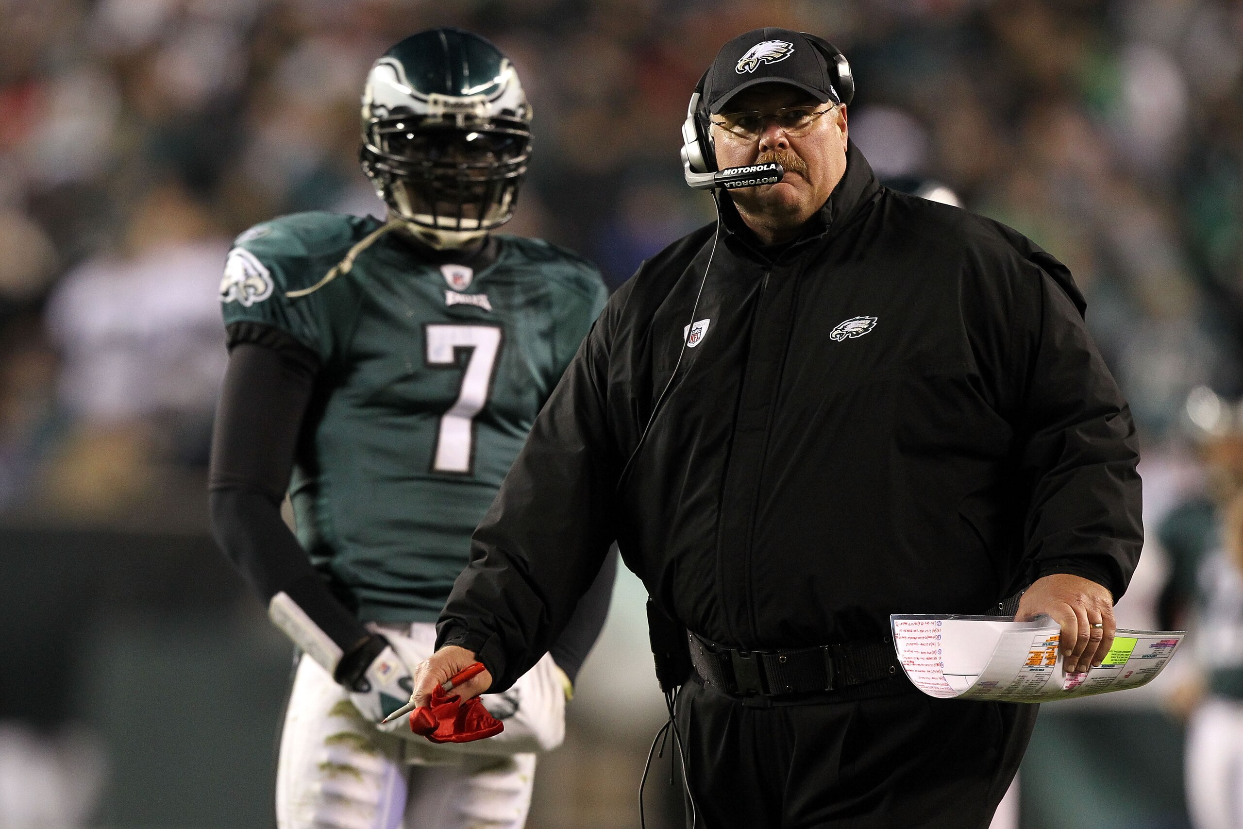 PHILADELPHIA, PA - DECEMBER 02:  Head coach Andy Reid of the Philadelphia Eagles throws the red challenge flag on a play involving Brent Celek #87 in the second half as Michael Vick #7 looks on against the Houston Texans at Lincoln Financial Field on Dece