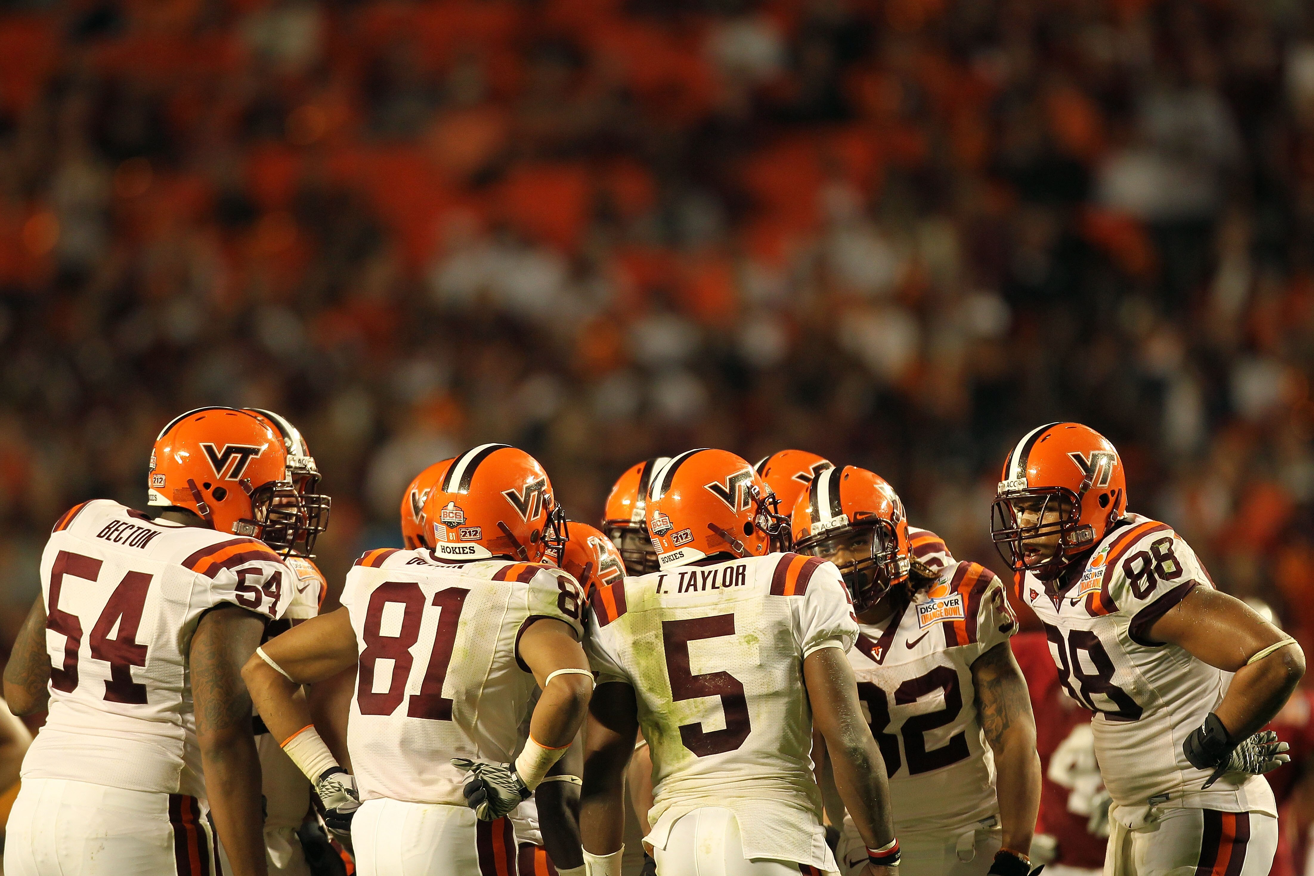 MIAMI, FL - JANUARY 03: Tyrod Taylor #5 of the Virginia Tech Hokies calls a play in the huddle against the Stanford Cardinal during the 2011 Discover Orange Bowl at Sun Life Stadium on January 3, 2011 in Miami, Florida. (Photo by Mike Ehrmann/Getty Images