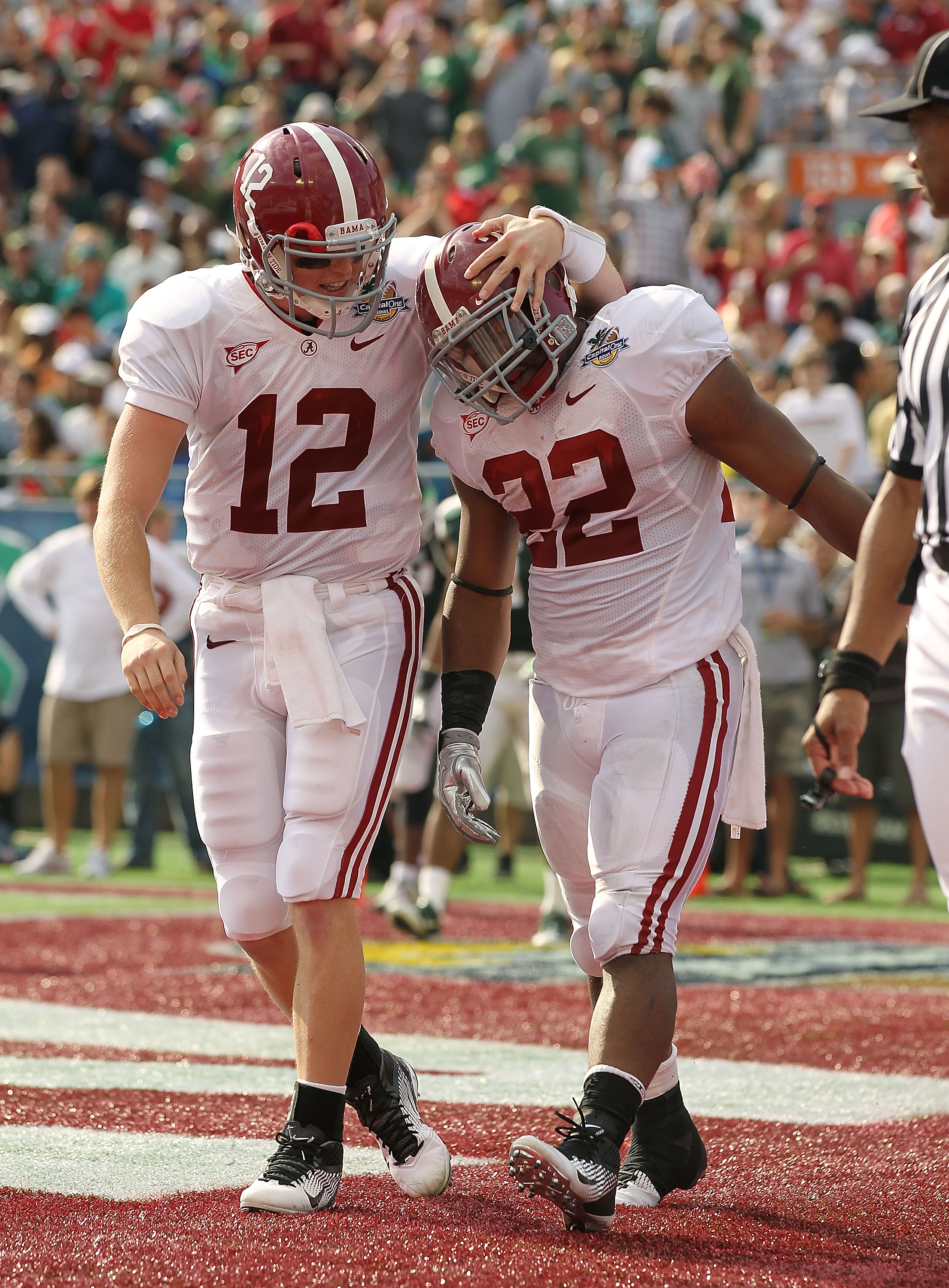 ORLANDO, FL - JANUARY 01:  Greg McElroy #12 of the Alabama Crimson Tide congratulates Mark Ingram #22 after a touchdown during the Capitol One Bowl against the Michigan State Spartans at the Florida Citrus Bowl on January 1, 2011 in Orlando, Florida.  (Ph