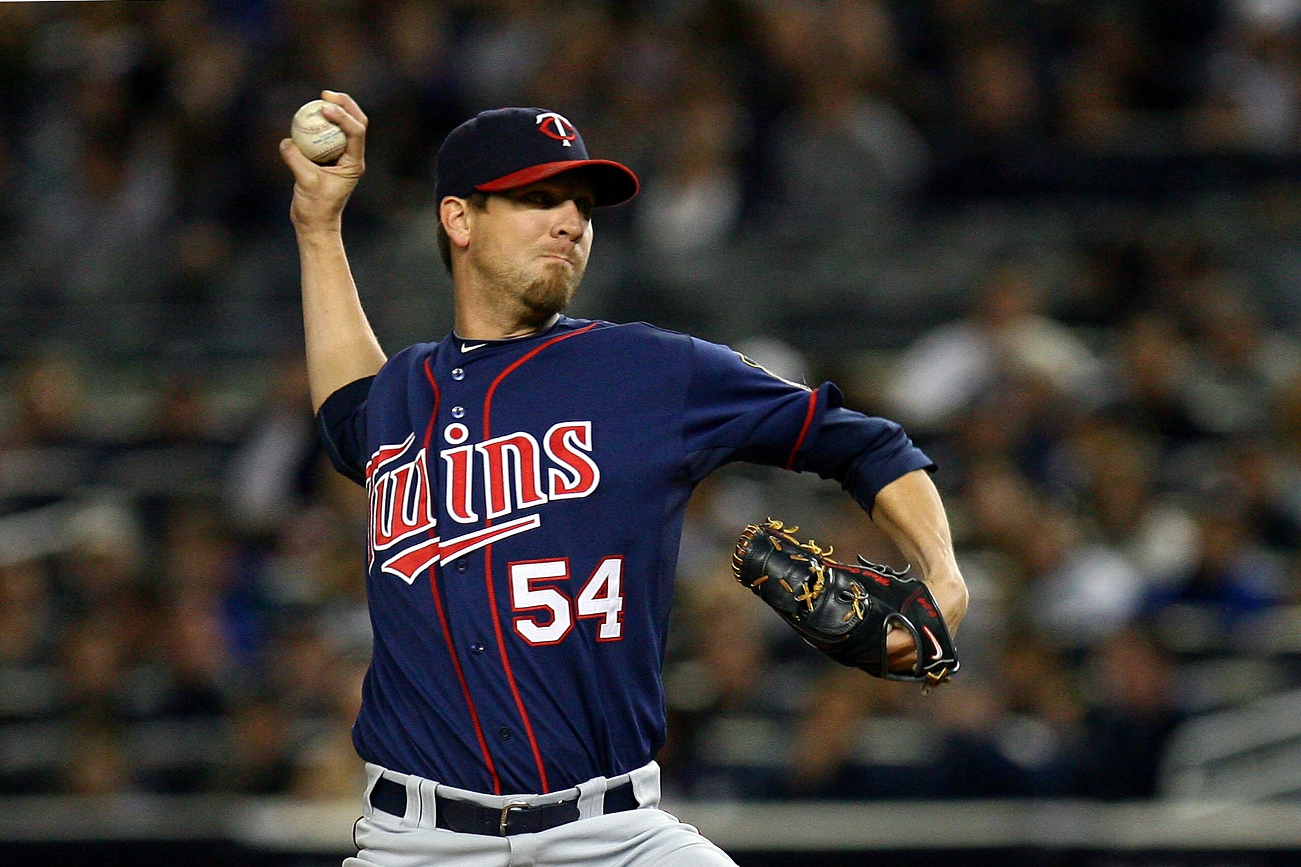 NEW YORK - OCTOBER 09:  Matt Guerrier #54 of the Minnesota Twins throws a pitch against the New York Yankees during Game Three of the ALDS part of the 2010 MLB Playoffs at Yankee Stadium on October 9, 2010 in the Bronx borough of New York City.  (Photo by