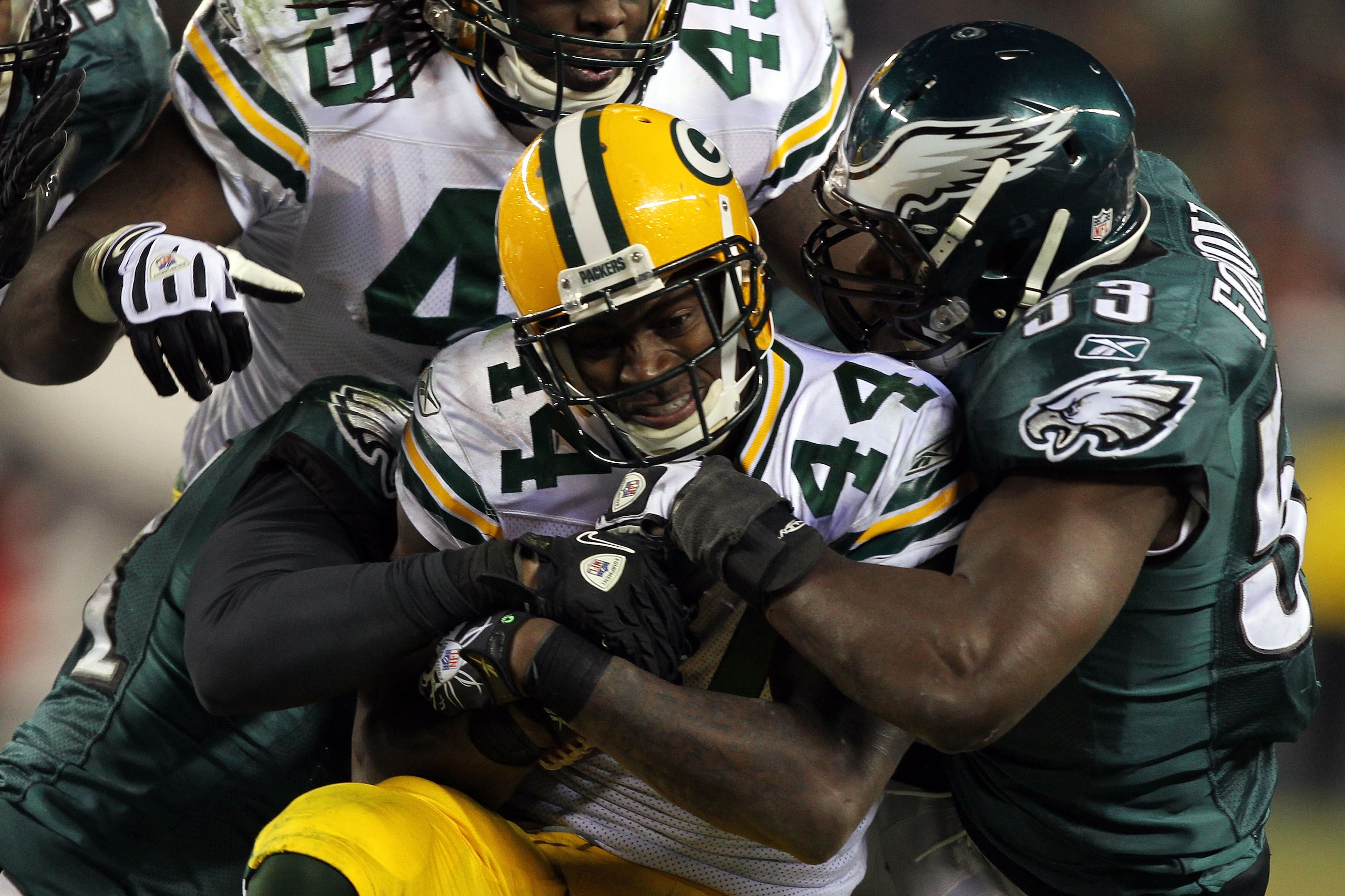PHILADELPHIA, PA - JANUARY 09:  James Starks #44 of the Green Bay Packers is tackled by Moise Fokou #53 of the Philadelphia Eagles during the 2011 NFC wild card playoff game at Lincoln Financial Field on January 9, 2011 in Philadelphia, Pennsylvania.  (Ph