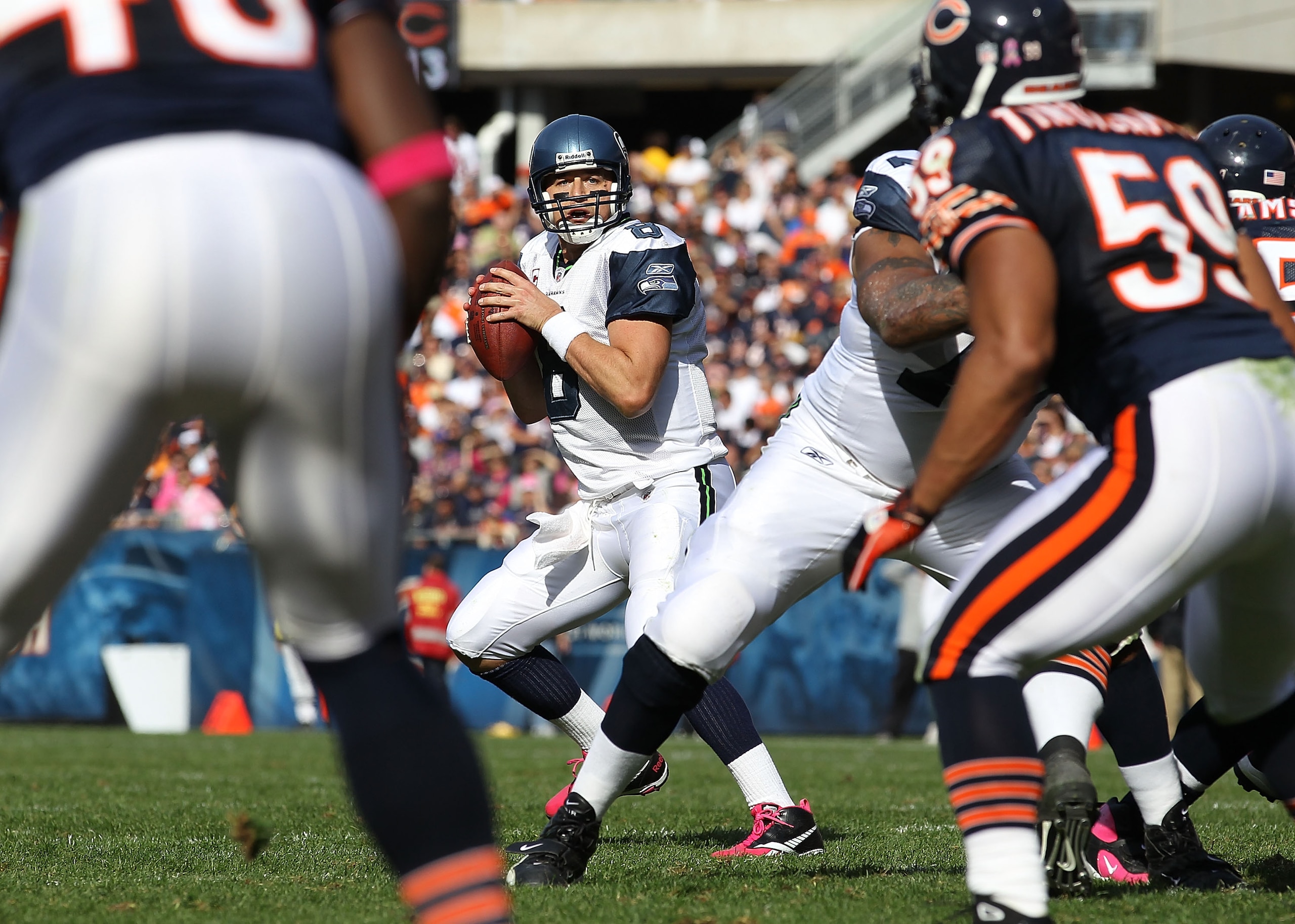 CHICAGO - OCTOBER 17: Matt Hasselbeck #8 of the Seattle Seahawks looks for a receiver against the Chicago Bears at Soldier Field on October 17, 2010 in Chicago, Illinois. The Seahawks defeated the Bears 23-20. (Photo by Jonathan Daniel/Getty Images)