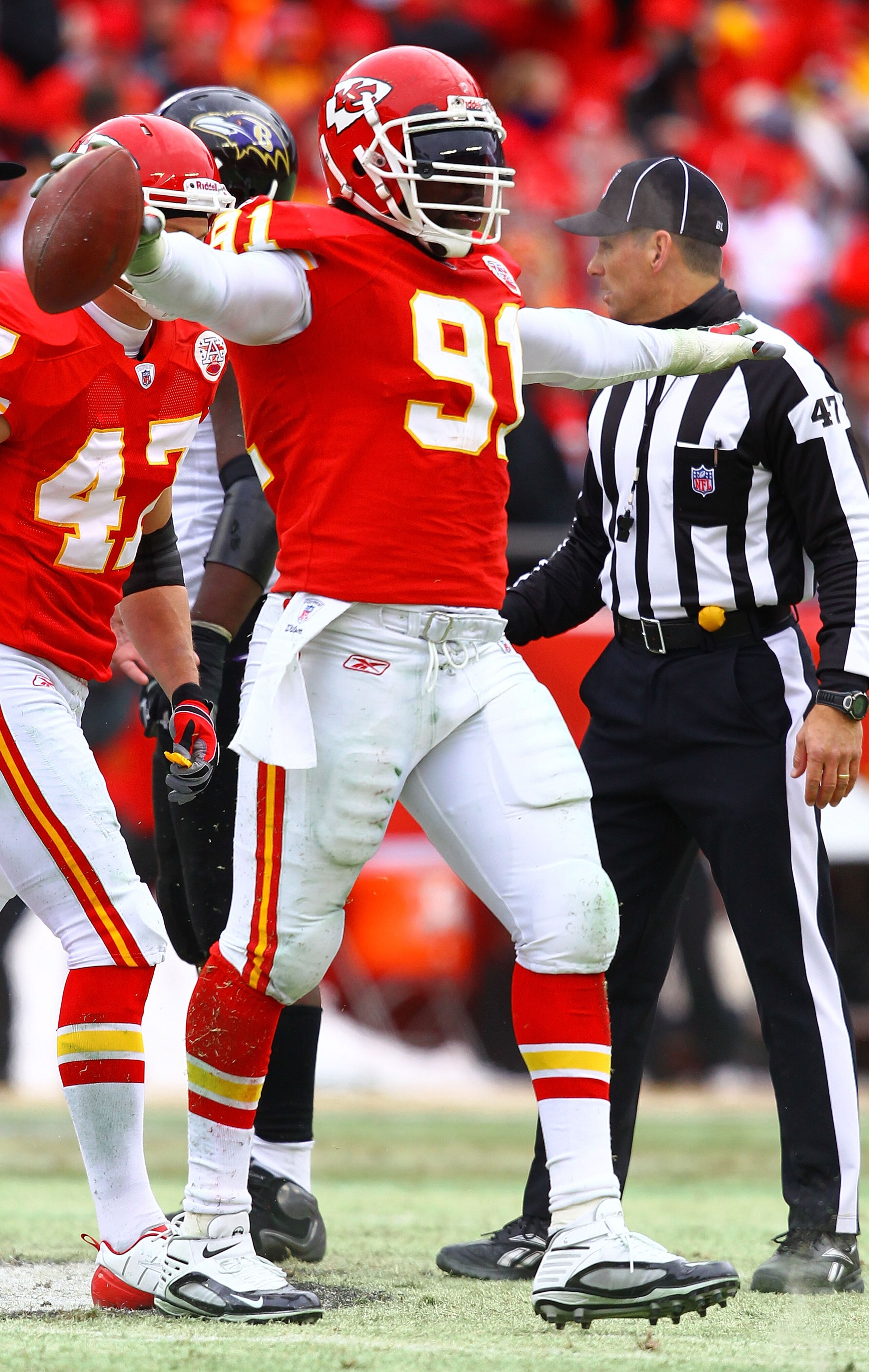 KANSAS CITY, MO - JANUARY 09:  Linebacker Tamba Hali #91 of the Kansas City Chiefs celebrates after recovering a fumble by the Baltimore Ravens during the first half of their 2011 AFC wild card playoff game at Arrowhead Stadium on January 9, 2011 in Kansa