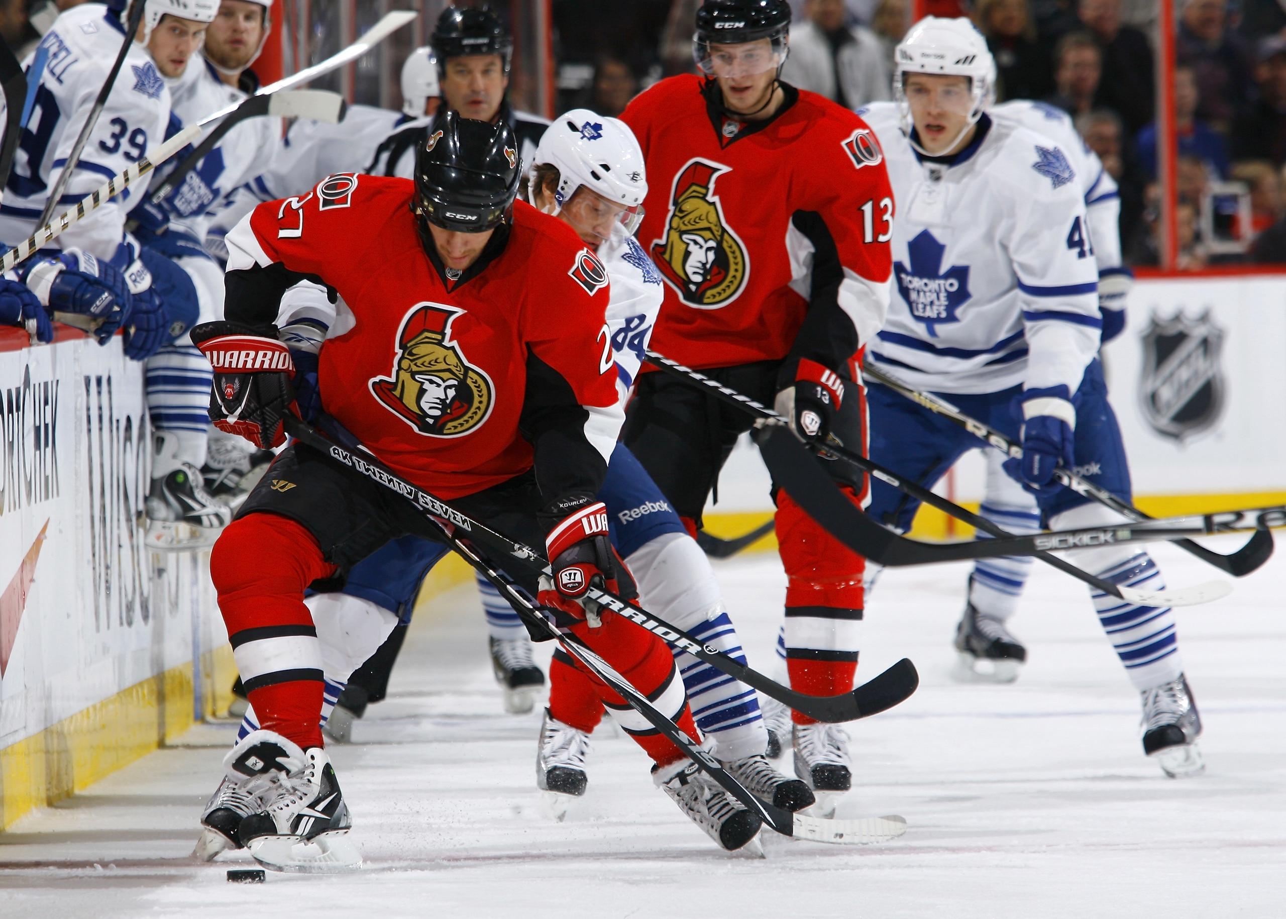 OTTAWA, ON - NOVEMBER 27:  Alex Kovalev #27 of the Ottawa Senators battles for the puck along the near boards with Mikhail Grabovski #84 of the Toronto Maple Leafs during a gam eat Scotiabank Place on November 27, 2010 in Ottawa, Ontario, Canada.  (Photo