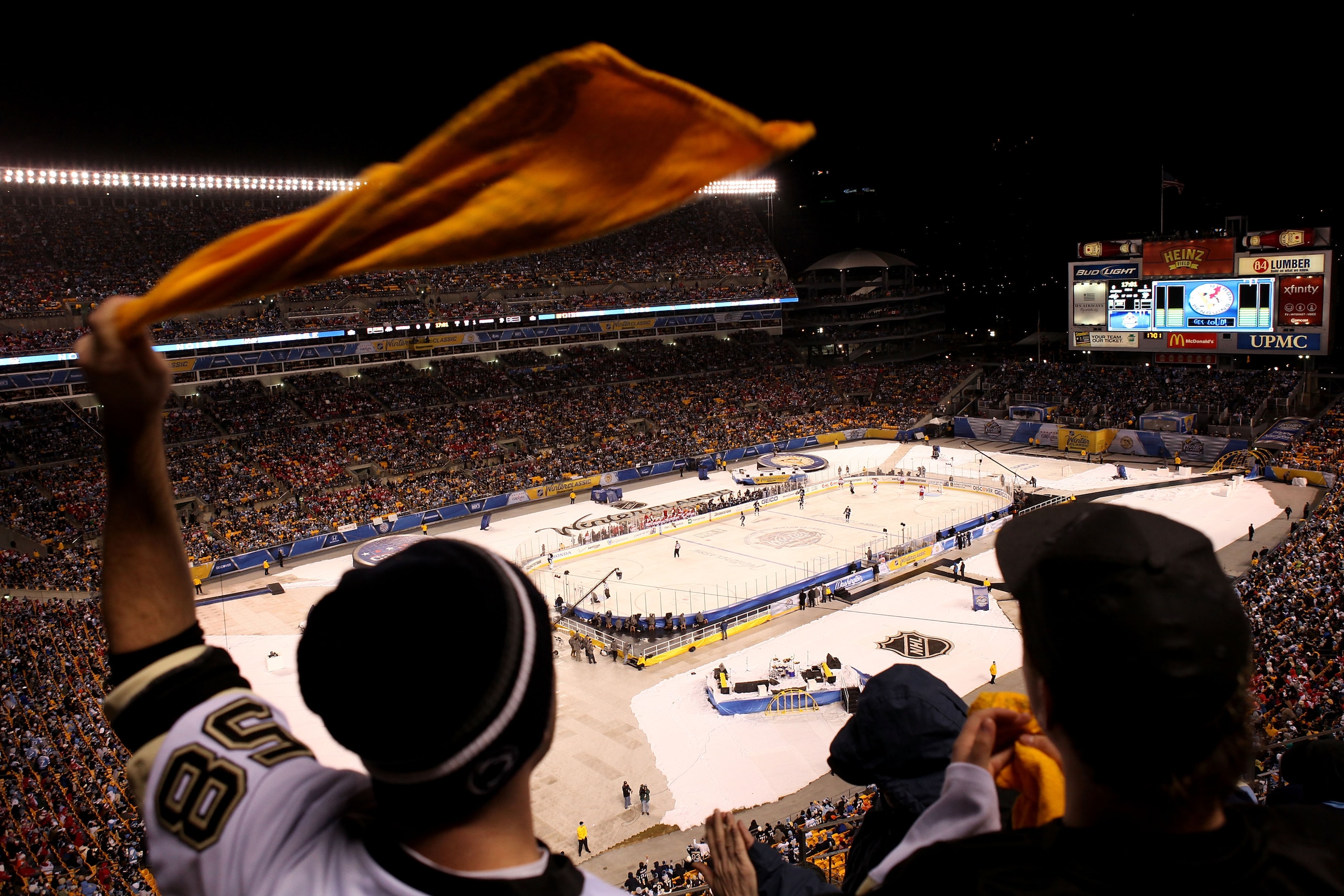PITTSBURGH, PA - JANUARY 01:  A fan of the Pittsburgh Penguins waves his 'terrible towel' as he cheers during the 2011 NHL Bridgestone Winter Classic against the Washington Capitals at Heinz Field on January 1, 2011 in Pittsburgh, Pennsylvania.  (Photo by