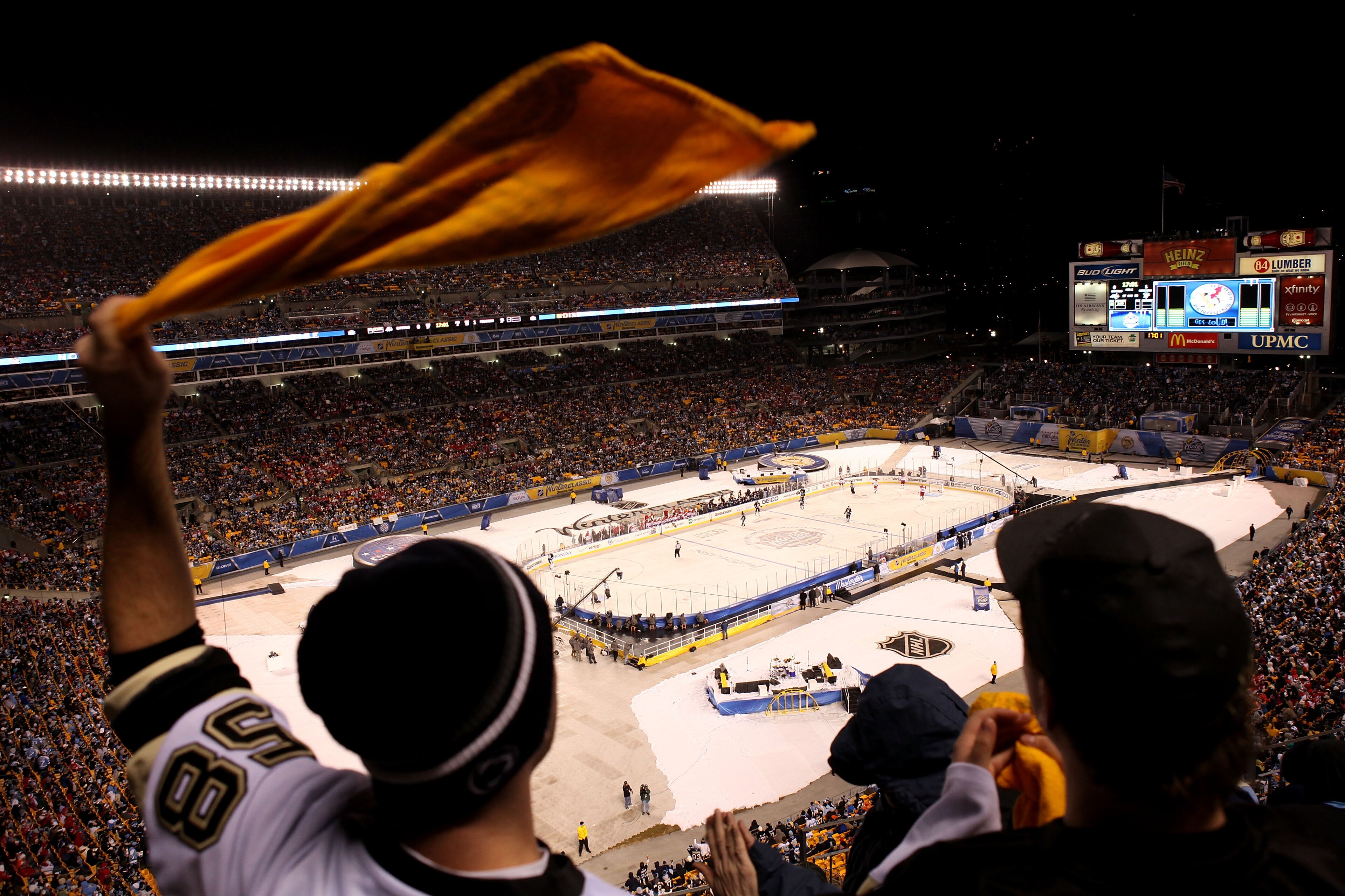 PITTSBURGH, PA - JANUARY 01:  A fan of the Pittsburgh Penguins waves his 'terrible towel' as he cheers during the 2011 NHL Bridgestone Winter Classic against the Washington Capitals at Heinz Field on January 1, 2011 in Pittsburgh, Pennsylvania.  (Photo by