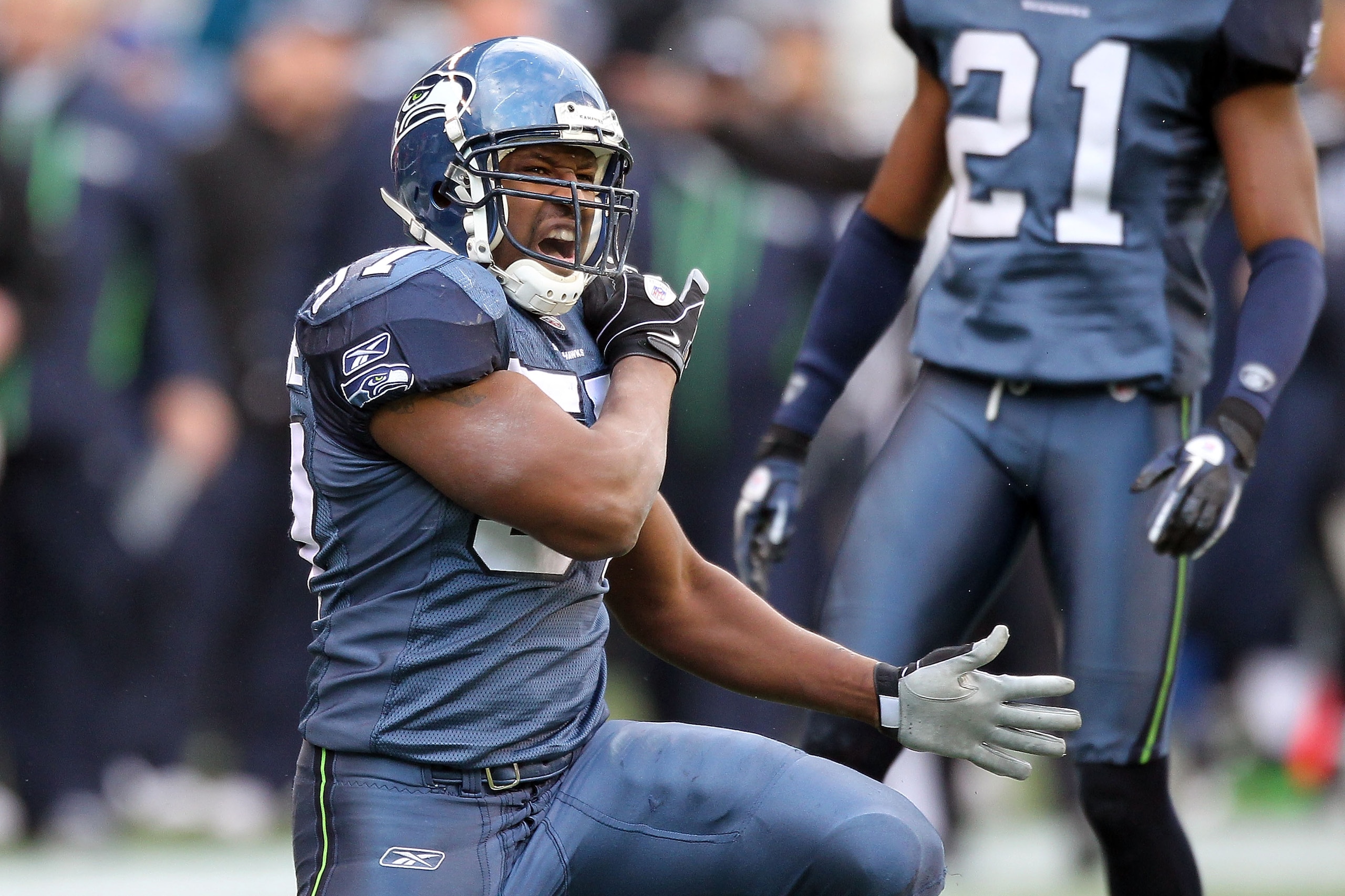 SEATTLE, WA - JANUARY 08: David Hawthorne #57 of the Seattle Seahawks reacts after a defensive stop in the second quarter against the New Orleans Saints during the 2011 NFC wild-card playoff game at Qwest Field on January 8, 2011 in Seattle, Washington. SEATTLE, WA - JANUARY 08: David Hawthorne #57 of the Seattle Seahawks reacts after a defensive stop in the second quarter against the New Orleans Saints during the 2011 NFC wild-card playoff game at Qwest Field on January 8, 2011 in Seattle, Washington.