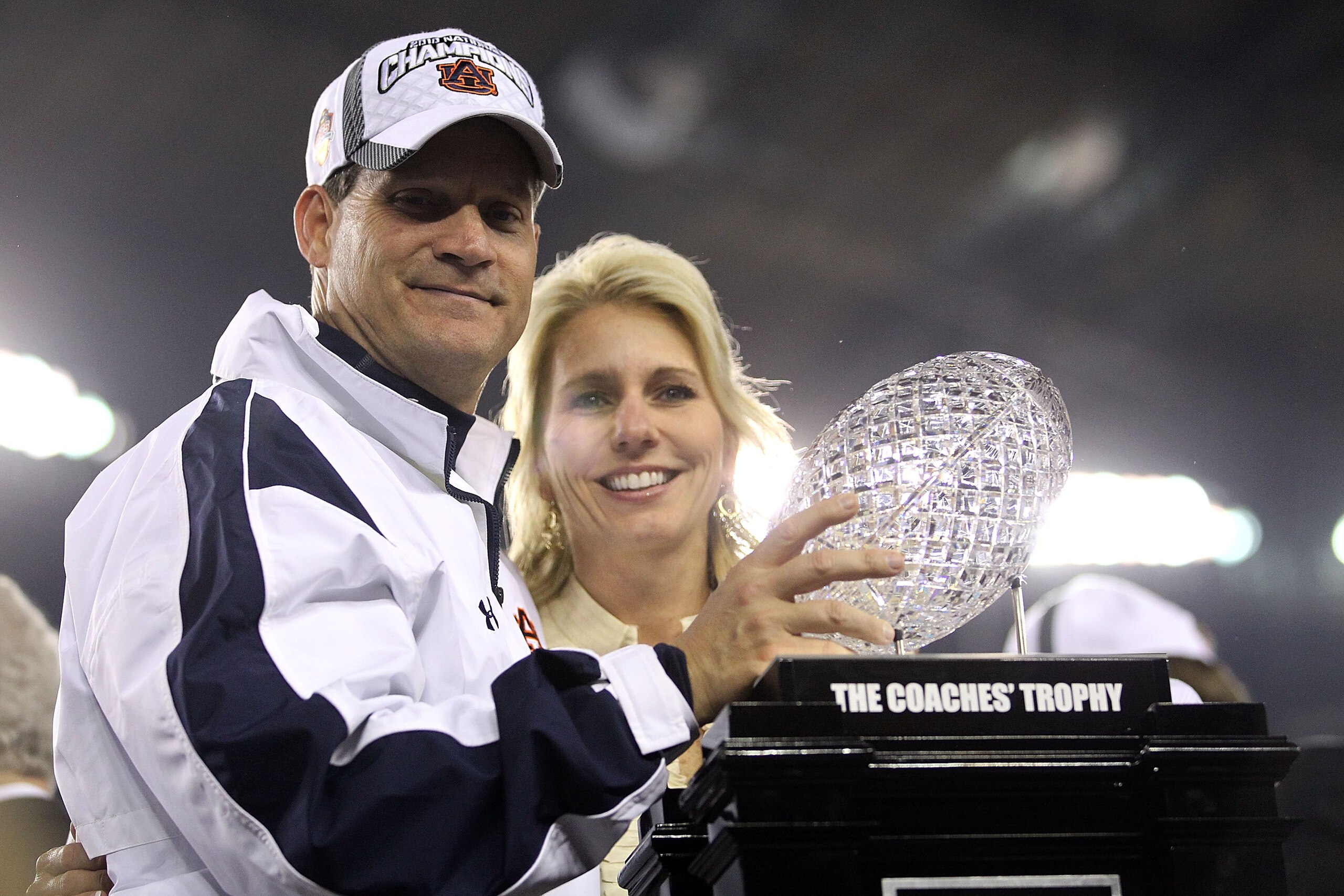 GLENDALE, AZ - JANUARY 10:  Head coach Gene Chizik of the Auburn Tigers celebrates the Tigers 22-19 victory as he holds up the Coaches Trophy after defeating the Oregon Ducks during the Tostitos BCS National Championship Game at University of Phoenix Stad