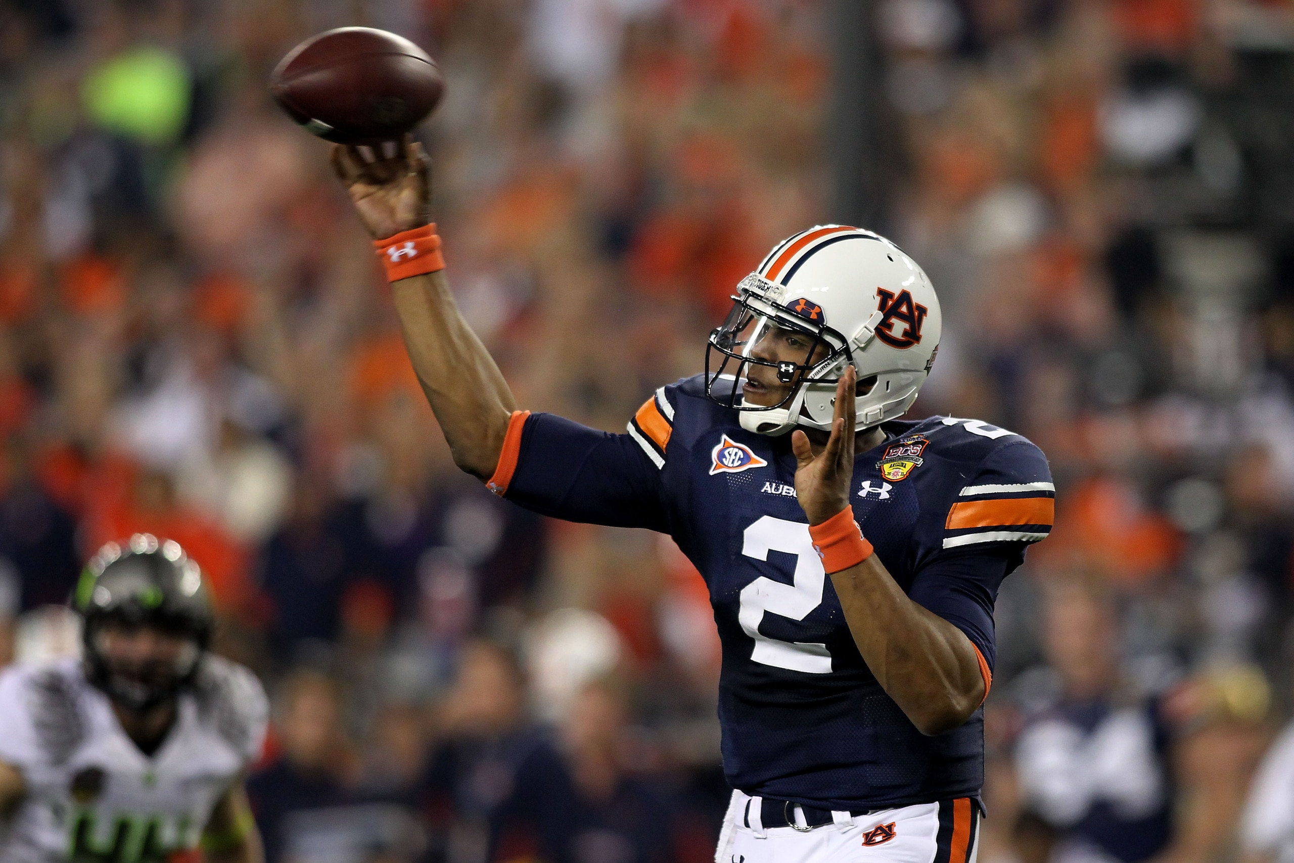 GLENDALE, AZ - JANUARY 10:  Quarterback Cameron Newton #2 of the Auburn Tigers throws the ball in the first quarter against the Oregon Ducks during the Tostitos BCS National Championship Game at University of Phoenix Stadium on January 10, 2011 in Glendal