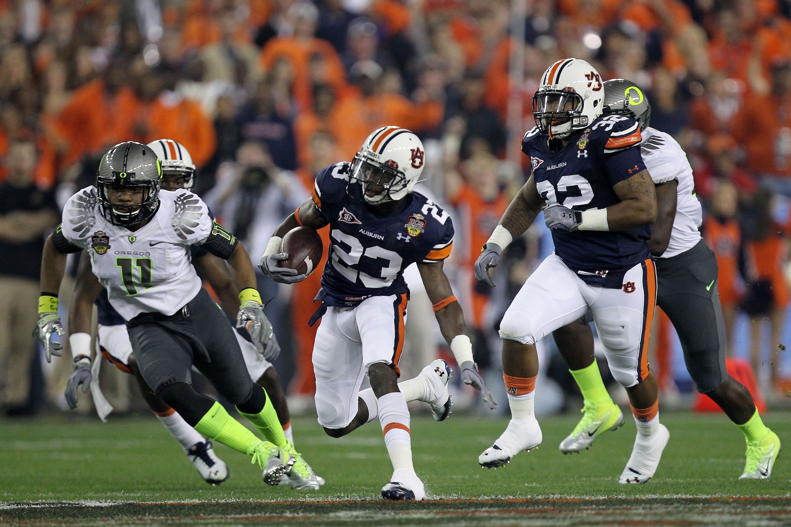 GLENDALE, AZ - JANUARY 10: Onterio McCalebb #23 of the Auburn Tigers runs the ball in the first quarter against the Oregon Ducks during the Tostitos BCS National Championship Game at University of Phoenix Stadium on January 10, 2011 in Glendale, Arizona. GLENDALE, AZ - JANUARY 10: Onterio McCalebb #23 of the Auburn Tigers runs the ball in the first quarter against the Oregon Ducks during the Tostitos BCS National Championship Game at University of Phoenix Stadium on January 10, 2011 in Glendale, Arizona.