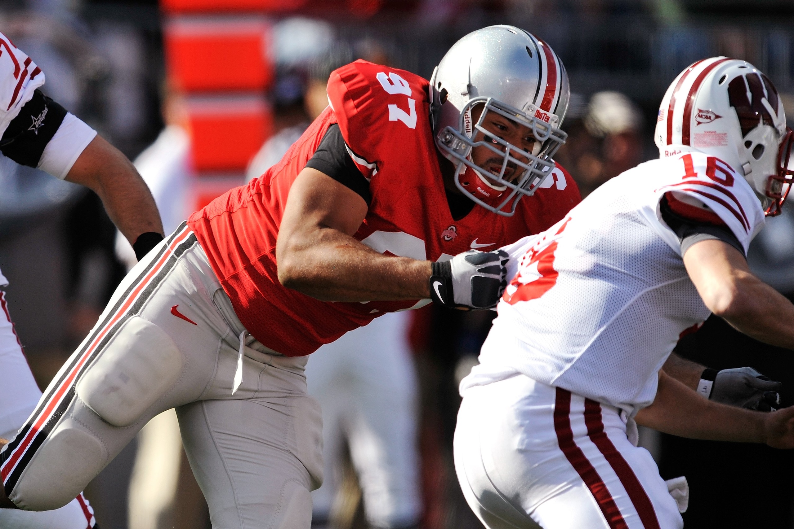 COLUMBUS, OH - OCTOBER 10:  Defensive lineman Cameron Heyward #97of the Ohio State Buckeyes makes a tackle on quarterback Scott Tolzien #16 of the Wisconsin Badgers at Ohio Stadium on October 10, 2009 in Columbus, Ohio.  (Photo by Jamie Sabau/Getty Images