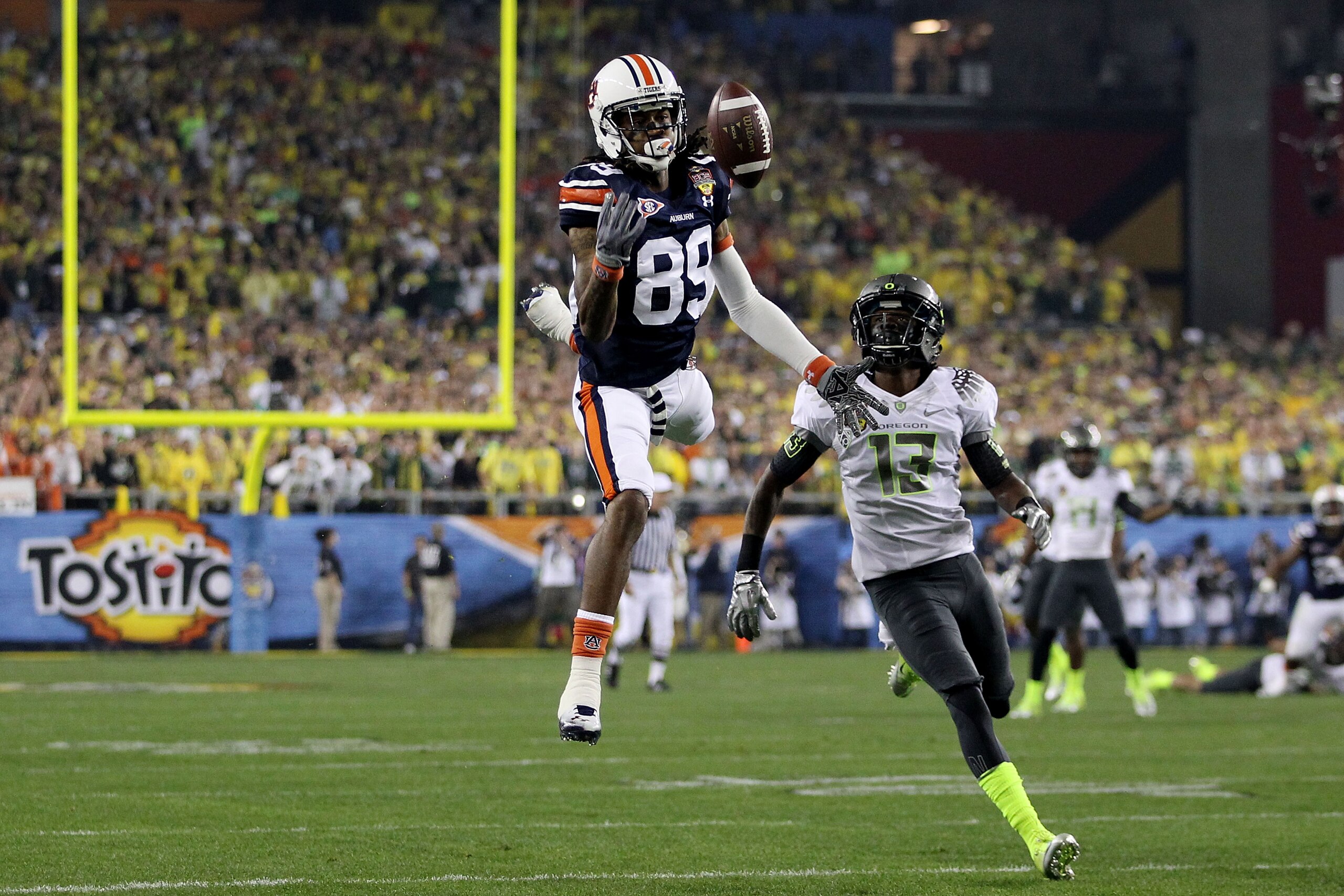 GLENDALE, AZ - JANUARY 10: Darvin Adams #89 of the Auburn Tigers is unable to make a catch in the first half against Cliff Harris #13 of the Oregon Ducks during the Tostitos BCS National Championship Game at University of Phoenix Stadium on January 10, 2 GLENDALE, AZ - JANUARY 10: Darvin Adams #89 of the Auburn Tigers is unable to make a catch in the first half against Cliff Harris #13 of the Oregon Ducks during the Tostitos BCS National Championship Game at University of Phoenix Stadium on January 10, 2