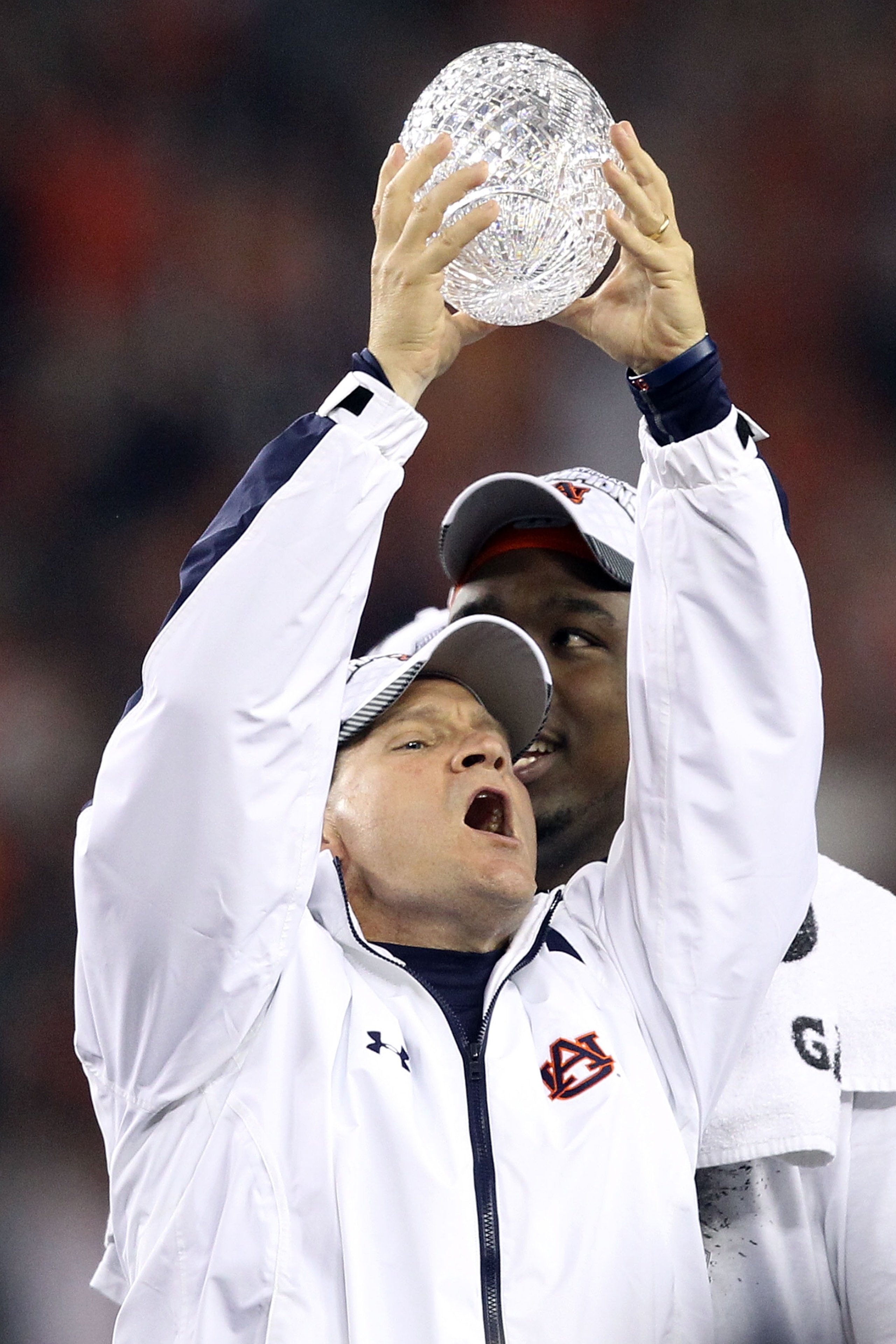 GLENDALE, AZ - JANUARY 10: Head coach Gene Chizik of the Auburn Tigers celebrates the Tigers 22-19 victory as he holds up the Coaches Trophy after defeating the Oregon Ducks during the Tostitos BCS National Championship Game at University of Phoenix Stad GLENDALE, AZ - JANUARY 10: Head coach Gene Chizik of the Auburn Tigers celebrates the Tigers 22-19 victory as he holds up the Coaches Trophy after defeating the Oregon Ducks during the Tostitos BCS National Championship Game at University of Phoenix Stad