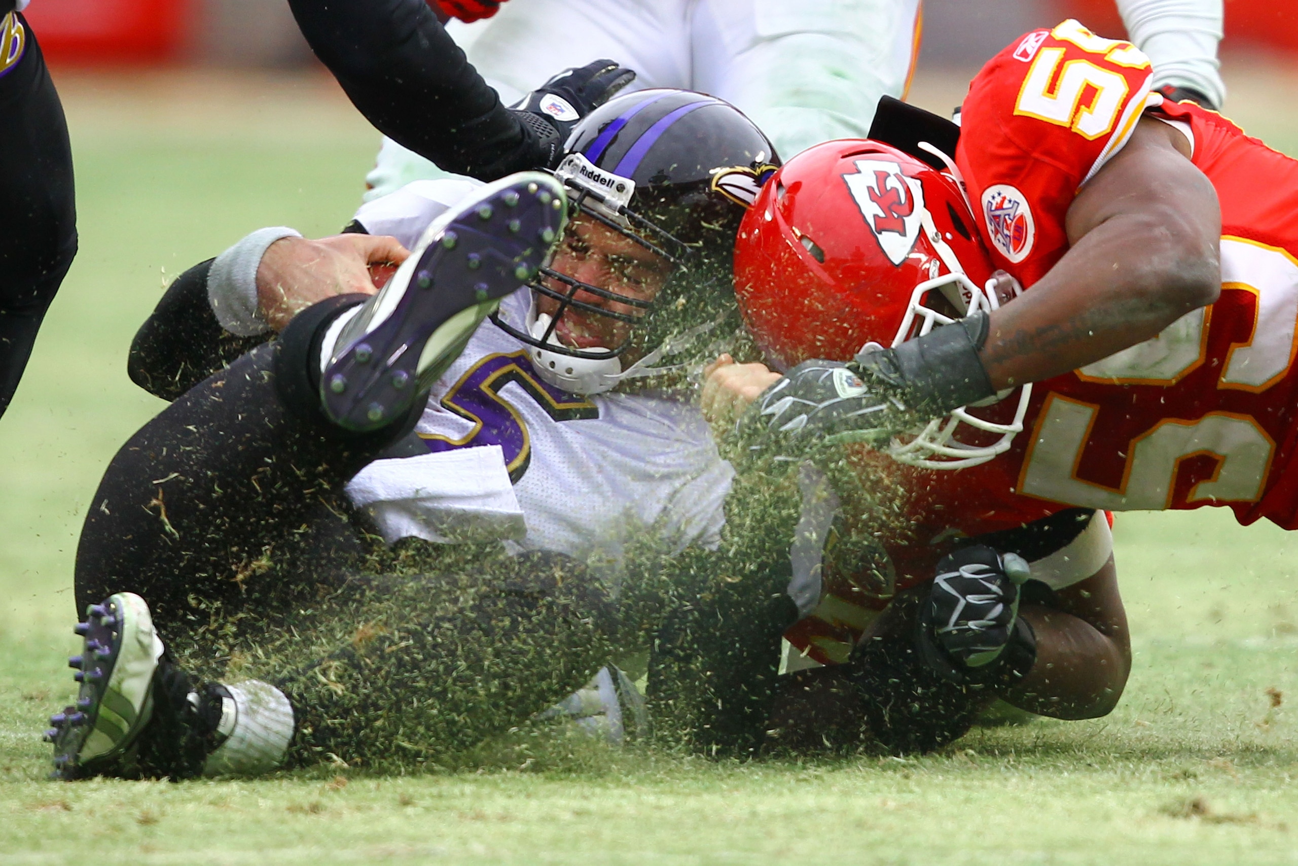 KANSAS CITY, MO - JANUARY 09: Quarterback Joe Flacco #5 of the Baltimore Ravens is hit by linebacker Jovan Belcher #59 of the Kansas City Chiefs after a five yard gain in the 2011 AFC wild card playoff game at Arrowhead Stadium on January 9, 2011 in Kans KANSAS CITY, MO - JANUARY 09: Quarterback Joe Flacco #5 of the Baltimore Ravens is hit by linebacker Jovan Belcher #59 of the Kansas City Chiefs after a five yard gain in the 2011 AFC wild card playoff game at Arrowhead Stadium on January 9, 2011 in Kans