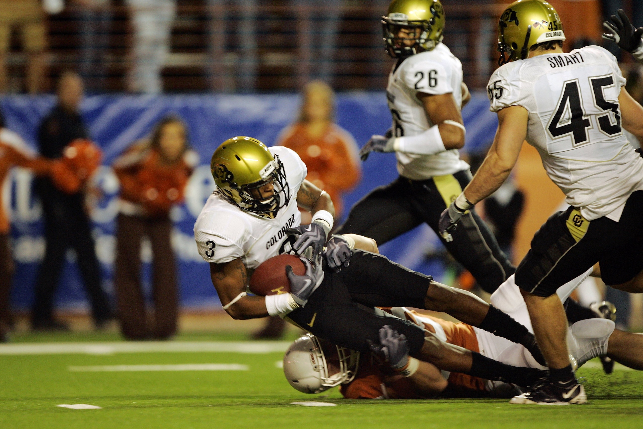 AUSTIN, TX - OCTOBER 10: Cornerback Jimmy Smith #3 of the Colorado Buffaloes picks up the loose ball which was knocked out of the hand of quarterback Colt McCoy of the Texas Longhorns in the second quarter on October 10, 2009 at Darrell K Royal-Texas Me AUSTIN, TX - OCTOBER 10: Cornerback Jimmy Smith #3 of the Colorado Buffaloes picks up the loose ball which was knocked out of the hand of quarterback Colt McCoy of the Texas Longhorns in the second quarter on October 10, 2009 at Darrell K Royal-Texas Me