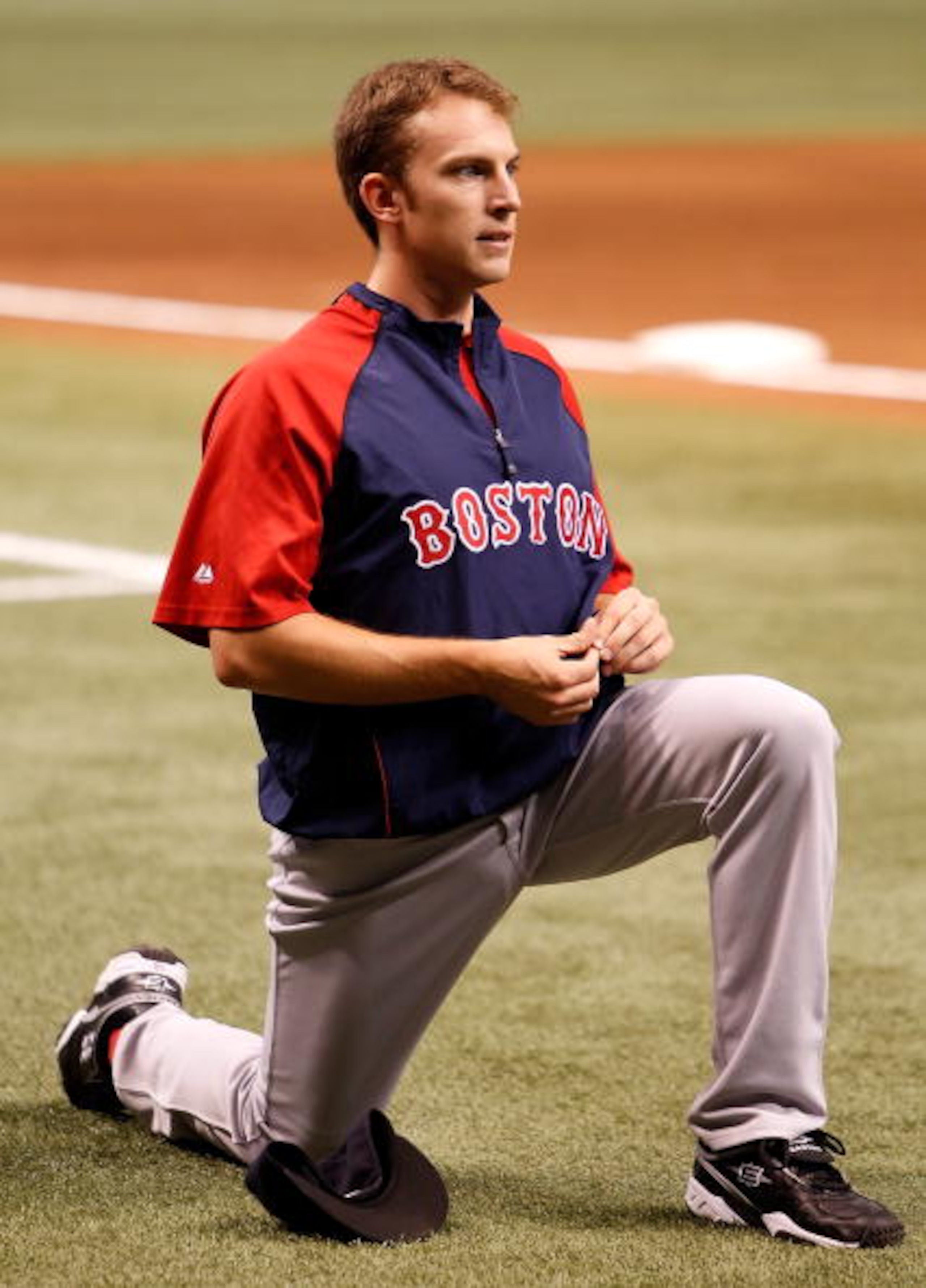 ST. PETERSBURG - AUGUST 27:  Infielder Jed Lowrie #12 of the Boston Red Sox warms up just before the start of the game against the Tampa Bay Rays at Tropicana Field on August 27, 2010 in St. Petersburg, Florida.  (Photo by J. Meric/Getty Images)