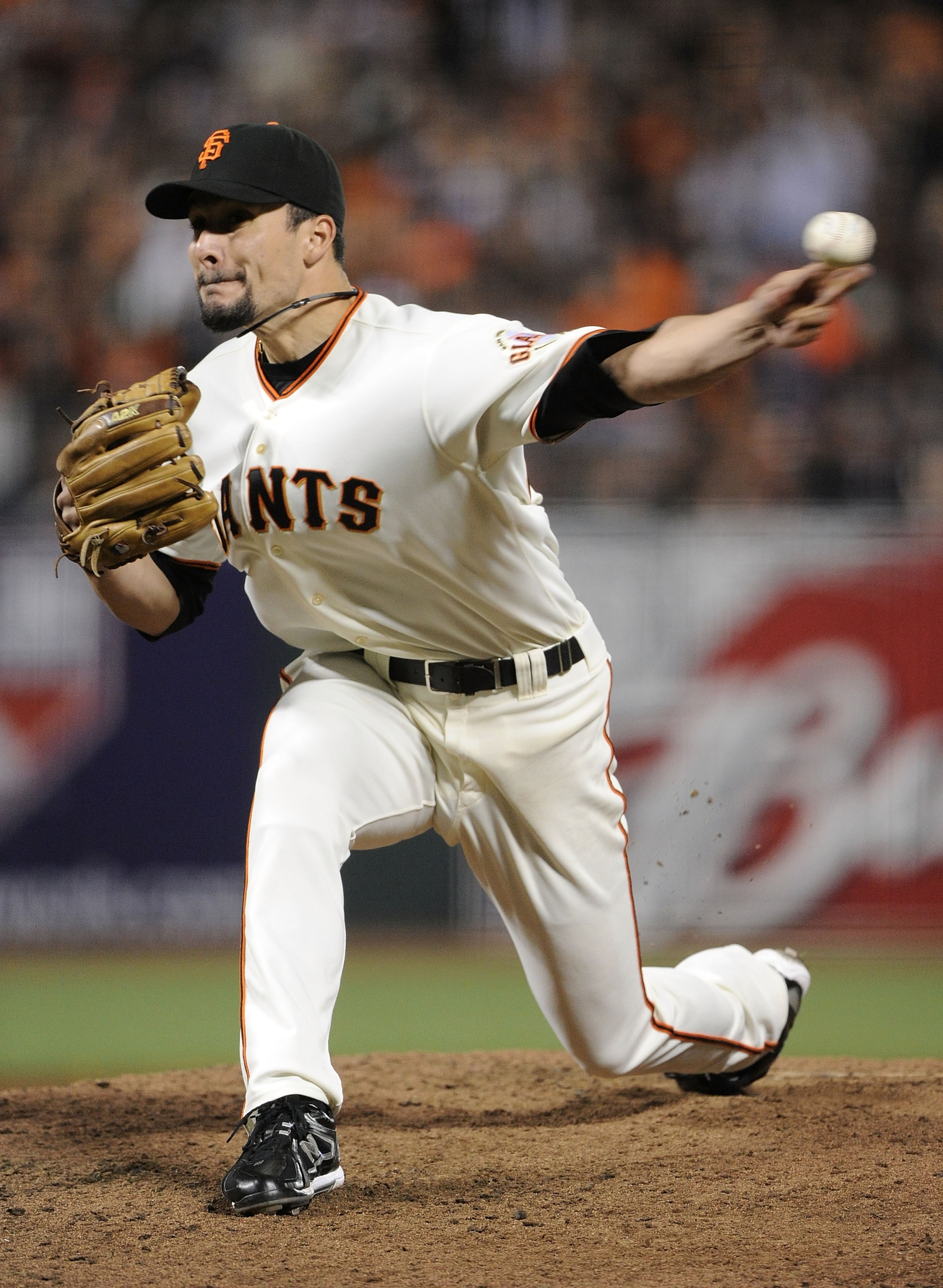 SAN FRANCISCO - OCTOBER 20:  Javier Lopez #49 of the San Francisco Giants throws a pitch against the Philadelphia Phillies in the eighth inning of Game Four of the NLCS during the 2010 MLB Playoffs at AT&T Park on October 20, 2010 in San Francisco, Califo