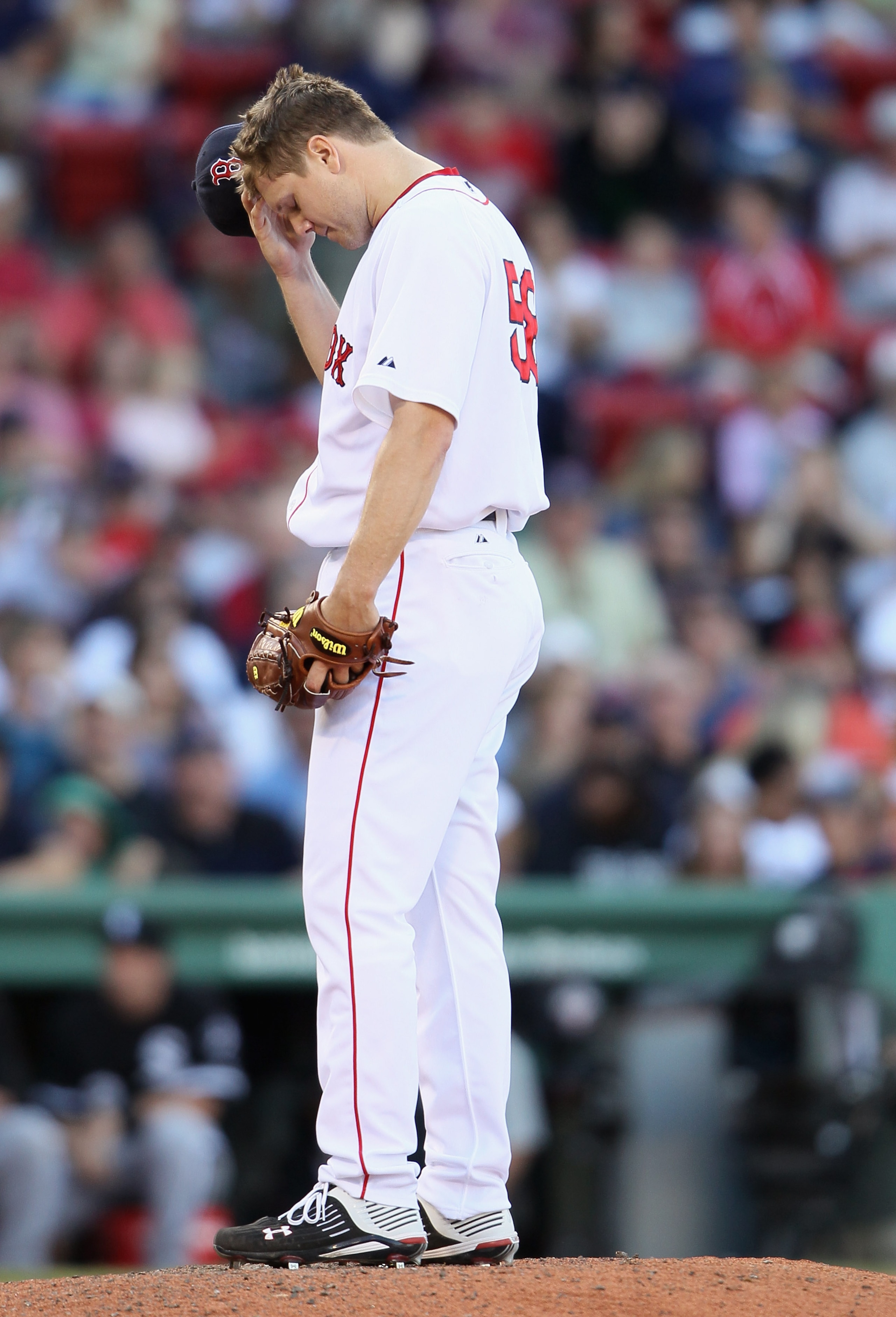 BOSTON - SEPTEMBER 05: Jonathan Papelbon #58 of the Boston Red Sox reacts after giving up 2 runs and walking another batter in the ninth inning against the Chicago White Sox on September 5, 2010 at Fenway Park in Boston, Massachusetts.  (Photo by Elsa/Get