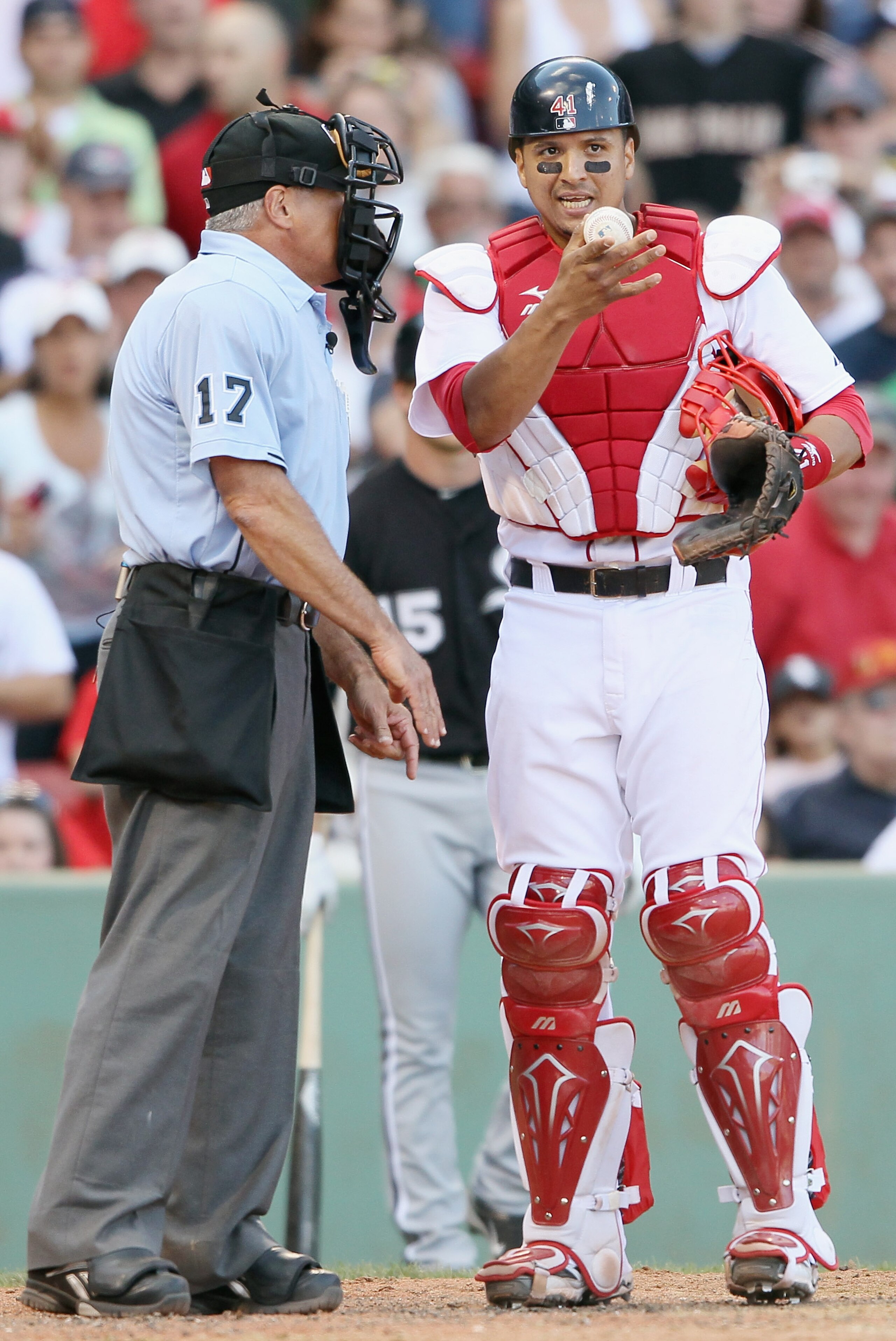 BOSTON - SEPTEMBER 05:  Victor Martinez #41 of the Boston Red Sox argues with John Hirshbeck #17 after Manny Ramirez of the Chicago White Sox was awarded first base on a hit by pitch call on September 5, 2010 at Fenway Park in Boston, Massachusetts.  (Pho