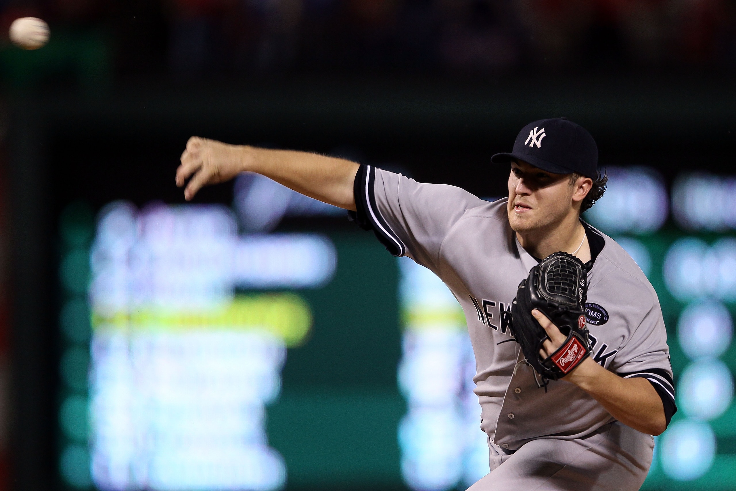 ARLINGTON, TX - OCTOBER 22:  Phil Hughes #65 of the New York Yankees throws a pitch against the New York Yankees in the first inning of Game Six of the ALCS during the 2010 MLB Playoffs at Rangers Ballpark in Arlington on October 22, 2010 in Arlington, Te
