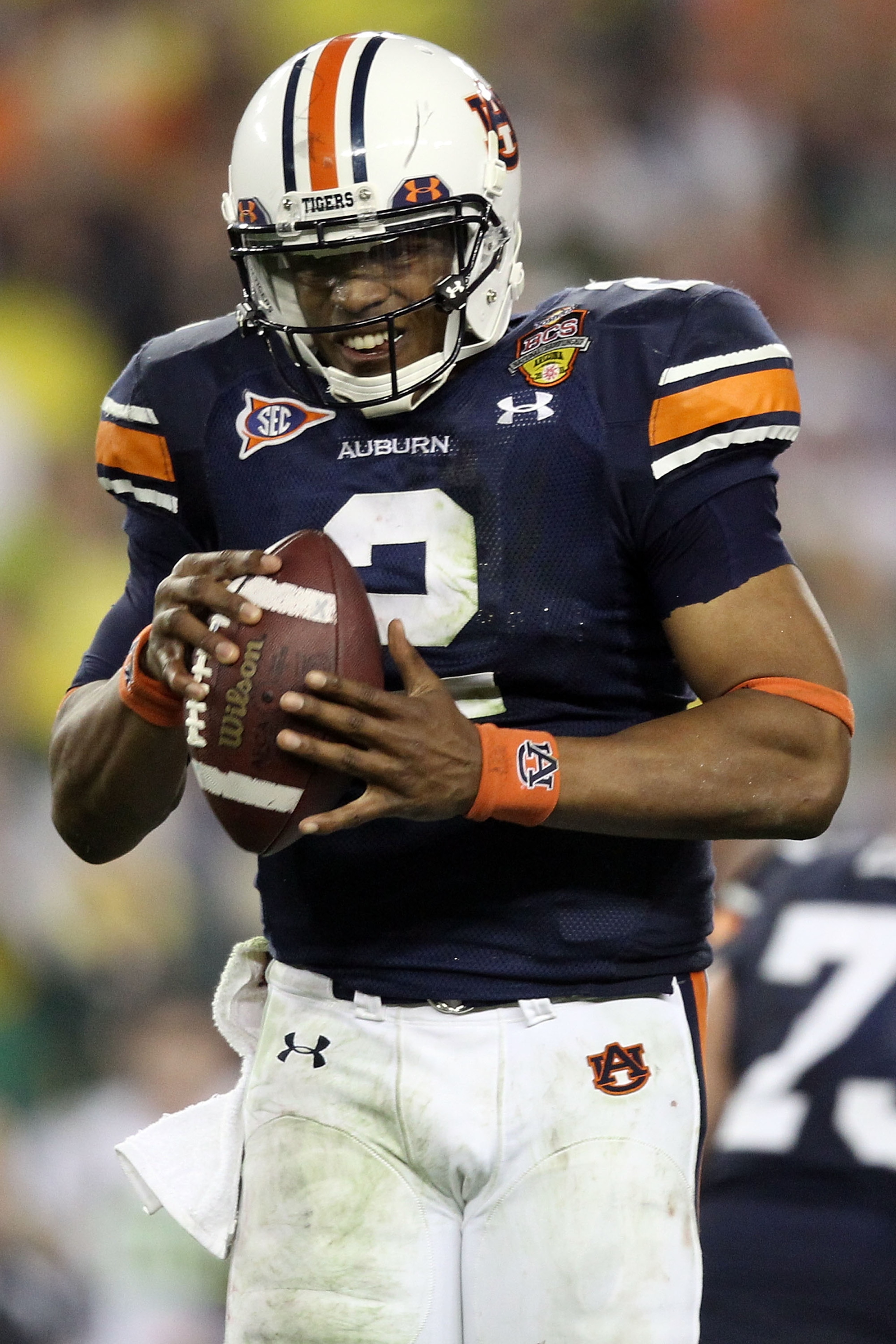 GLENDALE, AZ - JANUARY 10:  Quarterback Cameron Newton #2 of the Auburn Tigers reacts in the second half while taking on the Oregon Ducks during the Tostitos BCS National Championship Game at University of Phoenix Stadium on January 10, 2011 in Glendale,