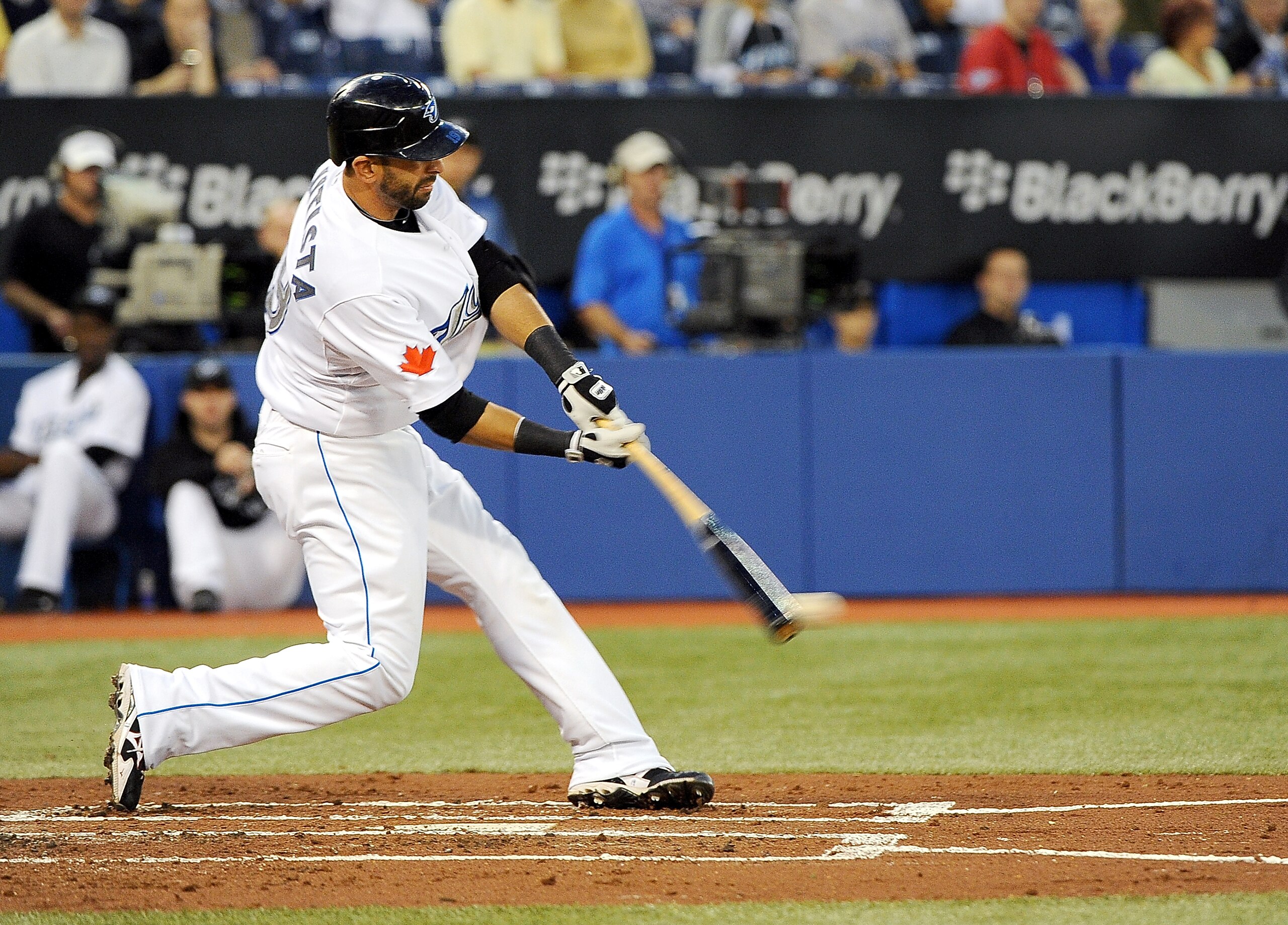 TORONTO, ON - SEPTEMBER 22: Jose Bautista #19 of the Toronto Blue Jays gets a hit during a game against the Seattle Mariners on September 22, 2010 in Toronto, Canada.  (Photo by Matthew Manor/Getty Images)
