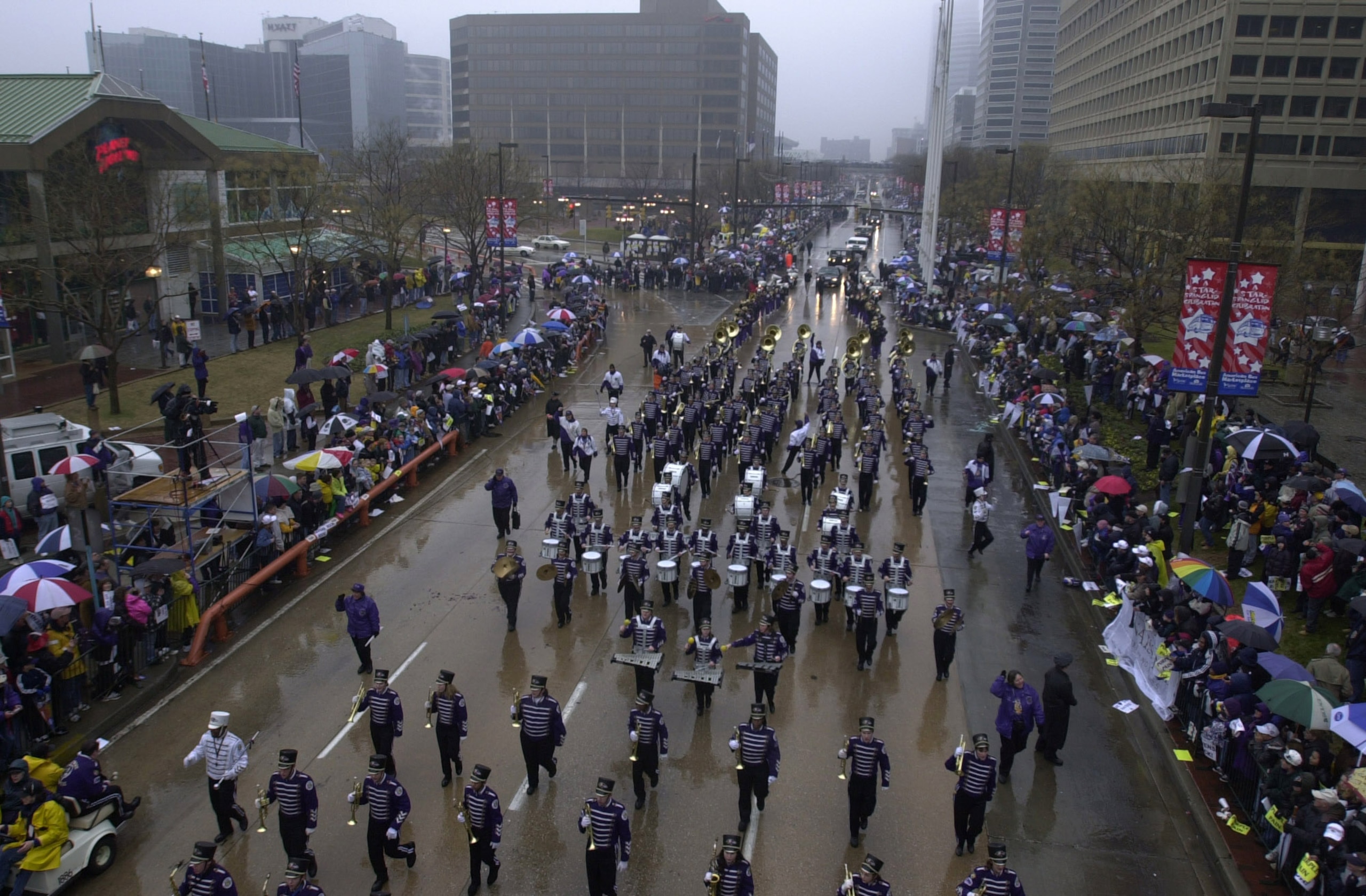 30 Jan 2001: The Baltimore Ravens Marching Band leads the Super Bowl victory parade down Pratt Street along the Inner Harbor toward City Hall through the rain soaked streets of downtown Baltimore, Maryland. Digital File Mandatory Credit: Doug Pensinger/A 30 Jan 2001: The Baltimore Ravens Marching Band leads the Super Bowl victory parade down Pratt Street along the Inner Harbor toward City Hall through the rain soaked streets of downtown Baltimore, Maryland. Digital File Mandatory Credit: Doug Pensinger/A