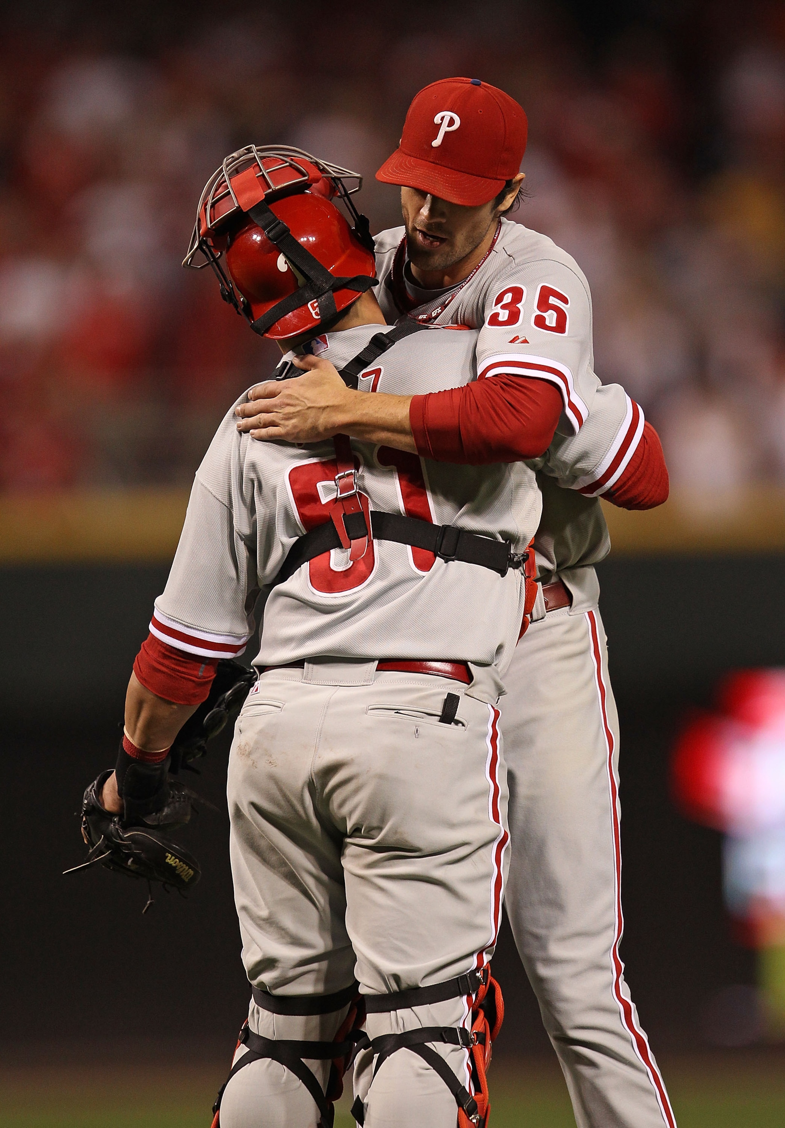 CINCINNATI - OCTOBER 10: Cole Hamels #35 of the Philadelphia Phillies hugs Carlos Ruiz #51 after throwing a complete game shut-out against the Cincinnati Reds during game 3 of the NLDS at Great American Ball Park on October 10, 2010 in Cincinnati, Ohio. T