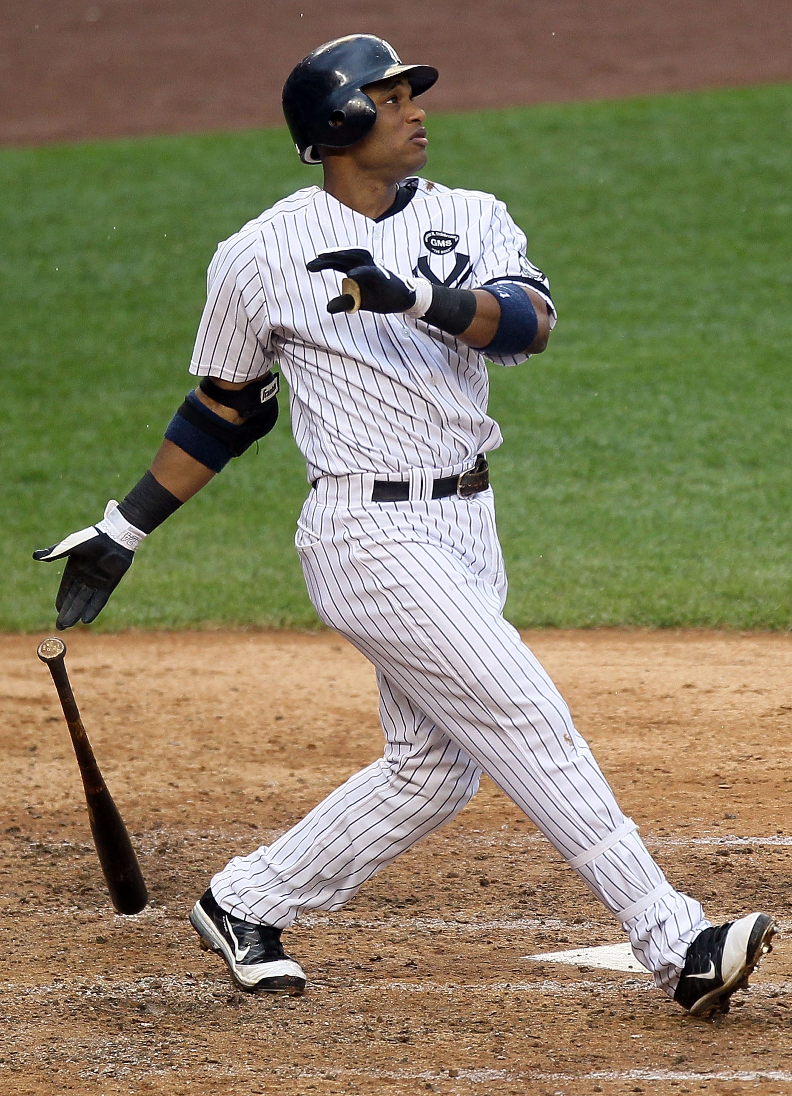 NEW YORK - AUGUST 22:  Robinson Cano #24 of the New York Yankees follows through on his fifth inning grand slam home run against the Seattle Mariners on August 22, 2010 at Yankee Stadium in the Bronx borough of New York City.  (Photo by Jim McIsaac/Getty