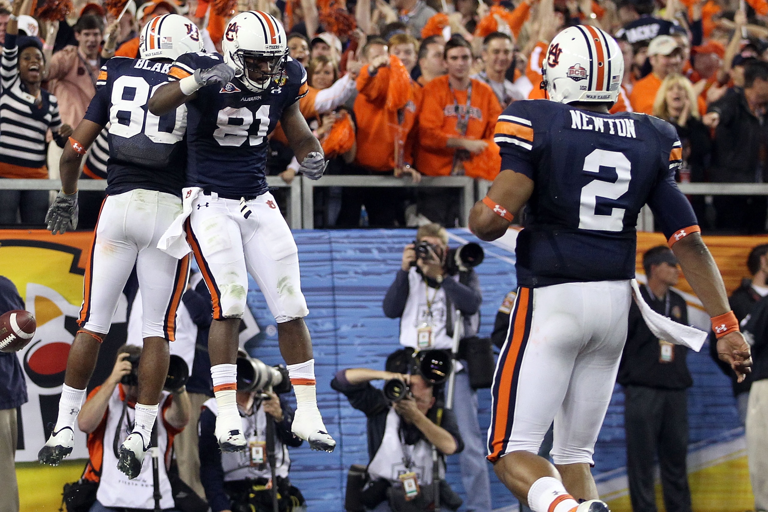 GLENDALE, AZ - JANUARY 10:  Emory Blake #80 and Terrell Zachery #81 of the Auburn Tigers celebrate Blake's second quarter touchdown as quarterback Cam Newton #2 joins them against the Oregon Ducks during the Tostitos BCS National Championship Game at Univ