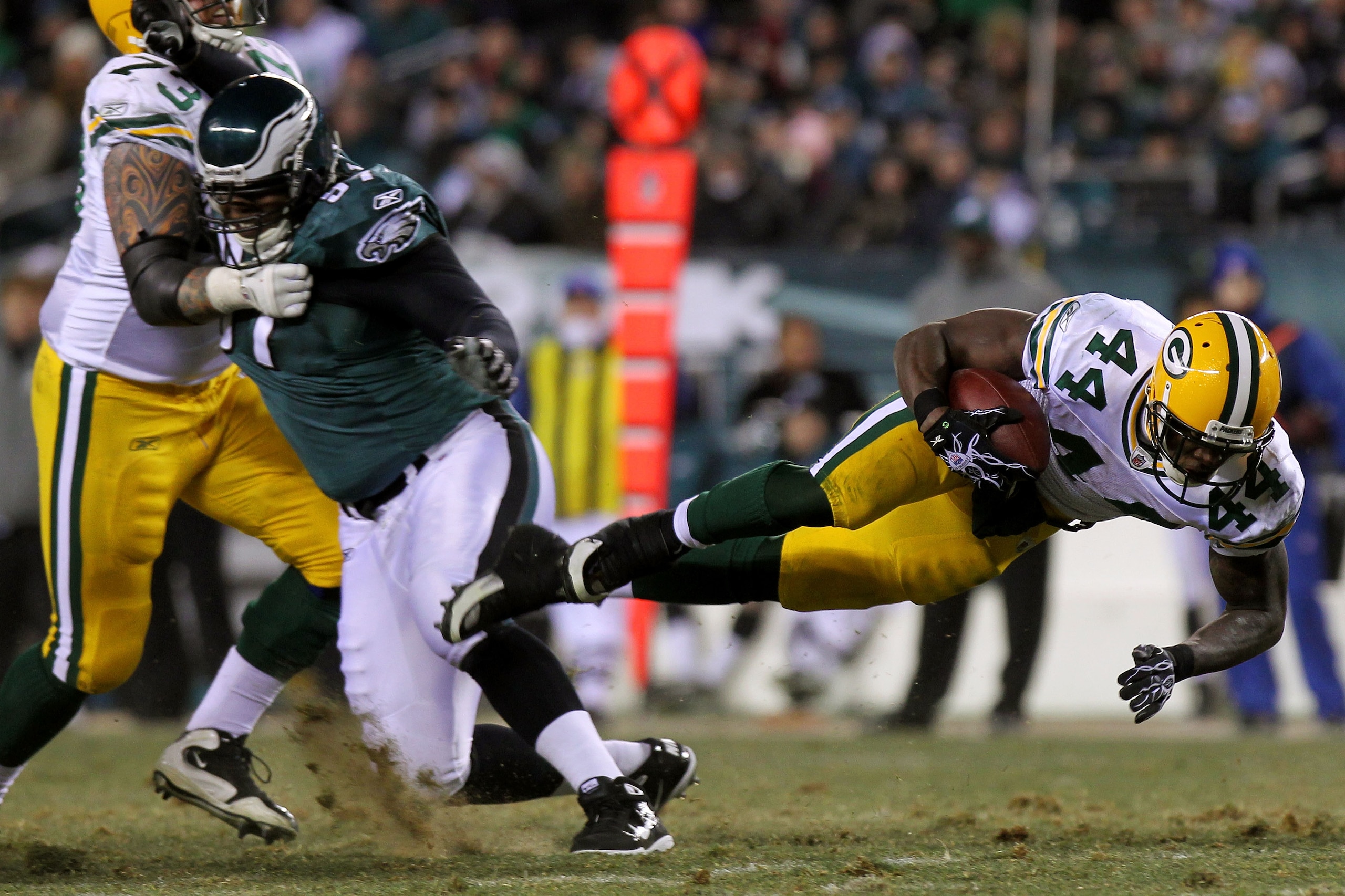 PHILADELPHIA, PA - JANUARY 09: James Starks #44 of the Green Bay Packers dives forward while on a run against Philadelphia Eagles during the 2011 NFC wild card playoff game at Lincoln Financial Field on January 9, 2011 in Philadelphia, Pennsylvania. (Ph PHILADELPHIA, PA - JANUARY 09: James Starks #44 of the Green Bay Packers dives forward while on a run against Philadelphia Eagles during the 2011 NFC wild card playoff game at Lincoln Financial Field on January 9, 2011 in Philadelphia, Pennsylvania. (Ph