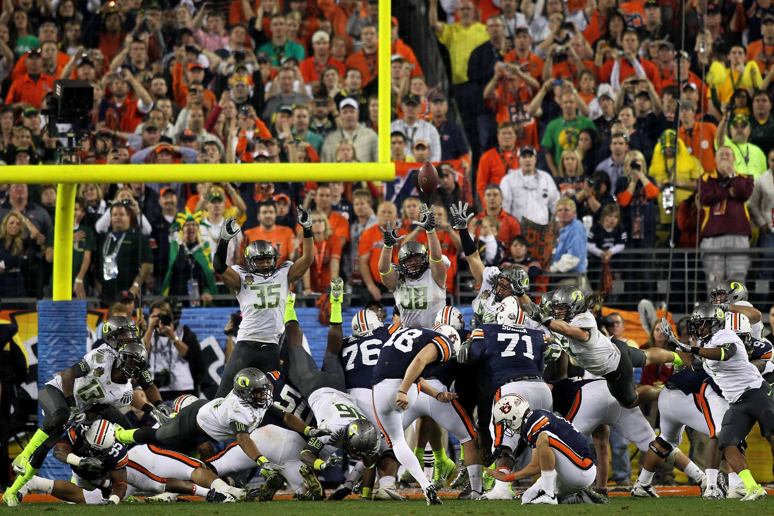 GLENDALE, AZ - JANUARY 10:  Kicker Wes Byrum #18 of the Auburn Tigers kicks a 19-yard game-winning field goal to defeat the Oregon Ducks 22-19 in the Tostitos BCS National Championship Game at University of Phoenix Stadium on January 10, 2011 in Glendale,